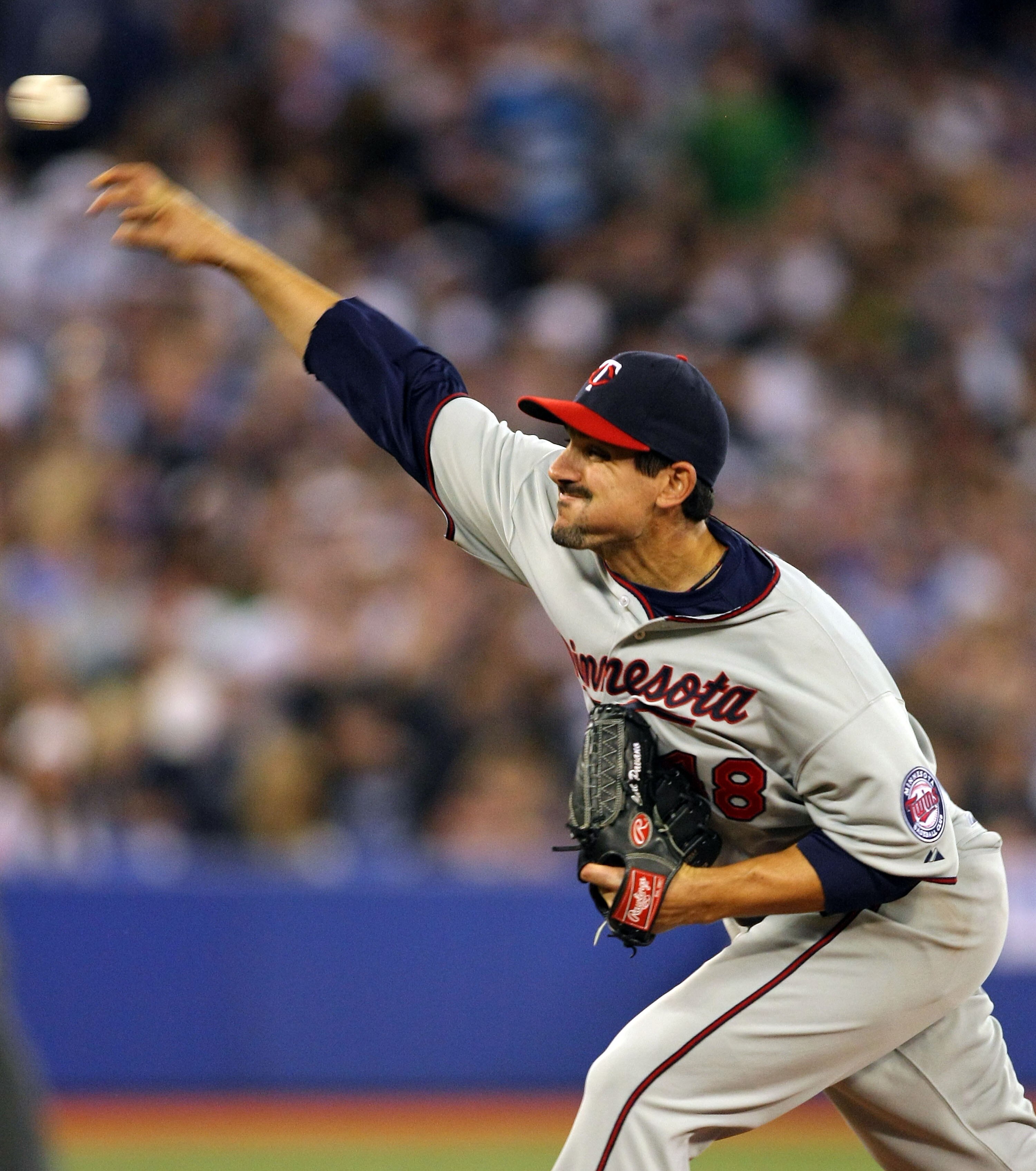 TORONTO,CANADA - APRIL 1:  Carl Pavano #48 of the Minnesota Twins throws a pitch against the Toronto Blue Jays on opening day during their MLB game at the Rogers Centre April 1, 2011 in Toronto, Ontario, Canada.(Photo By Dave Sandford/Getty Images)