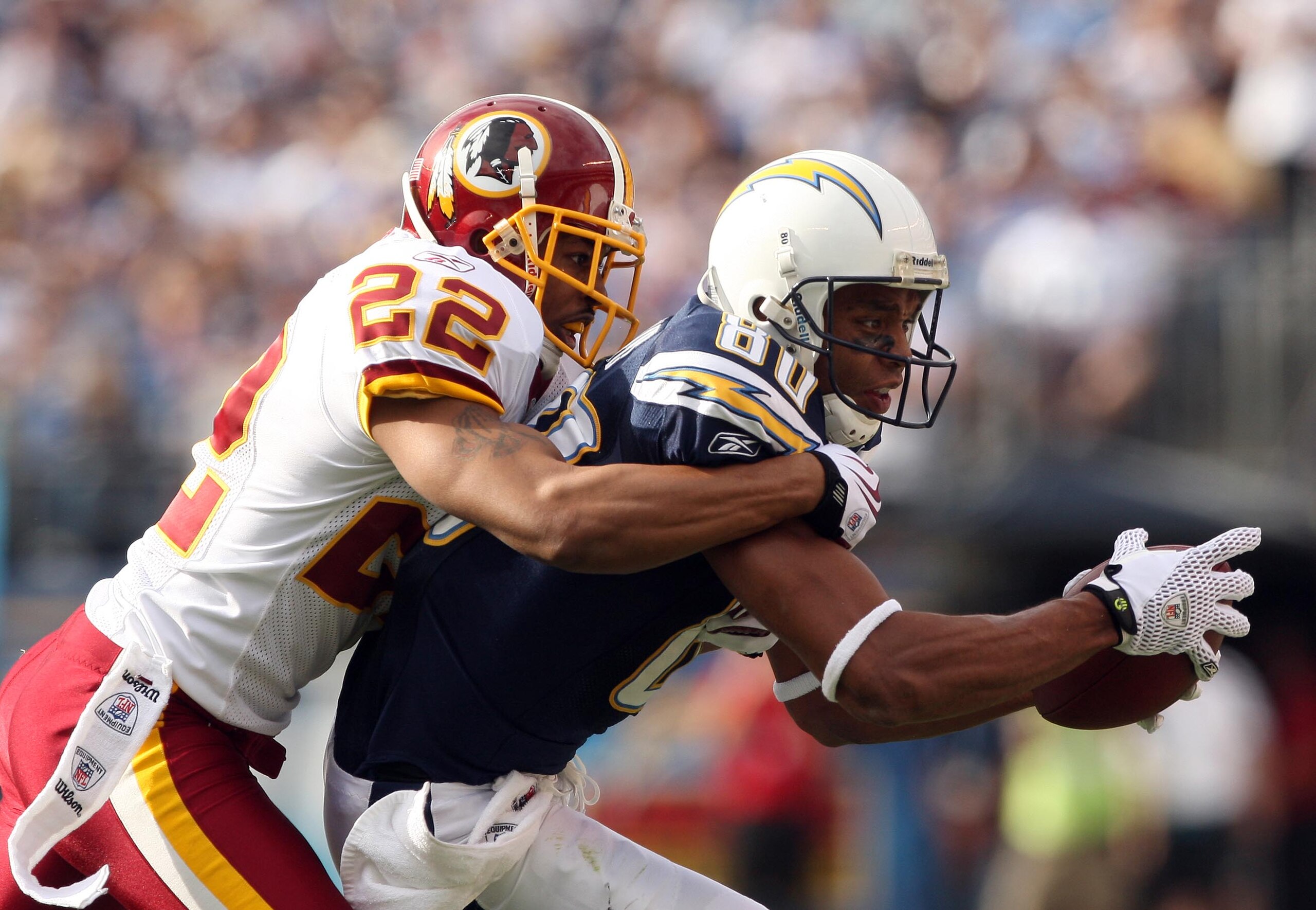 SAN DIEGO, CA - JANUARY 3: Wide Receiver Malcom Floyd #80 of the San Diego Chargers catches the ball for a reception against the defense of Cornerback Carlos Rodgers #22 of the Washington Redskins on January 3, 2010 at Quolcomm Stadium in San Diego, Cali SAN DIEGO, CA - JANUARY 3: Wide Receiver Malcom Floyd #80 of the San Diego Chargers catches the ball for a reception against the defense of Cornerback Carlos Rodgers #22 of the Washington Redskins on January 3, 2010 at Quolcomm Stadium in San Diego, Cali