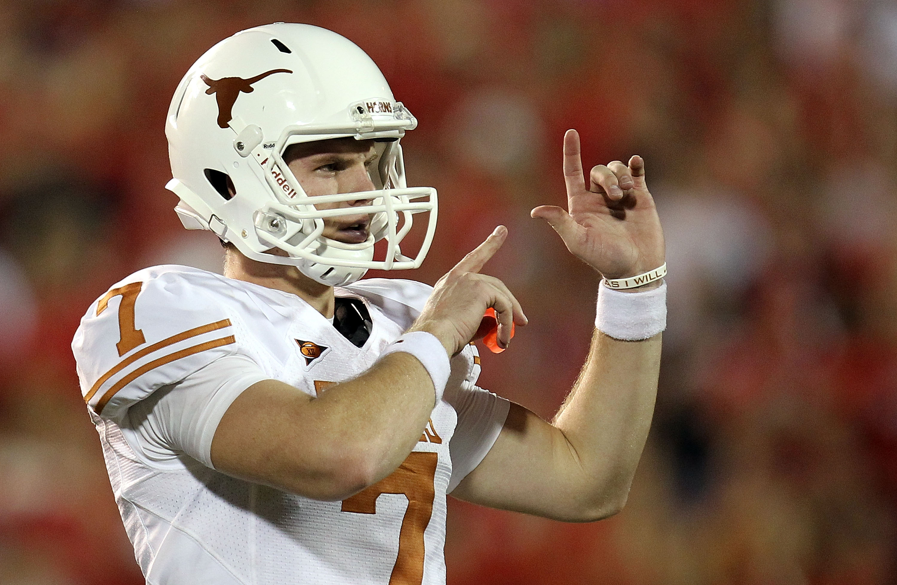LUBBOCK, TX - SEPTEMBER 18:  Quarterback Garrett Gilbert #7 of the Texas Longhorns at Jones AT&T Stadium on September 18, 2010 in Lubbock, Texas.  (Photo by Ronald Martinez/Getty Images)