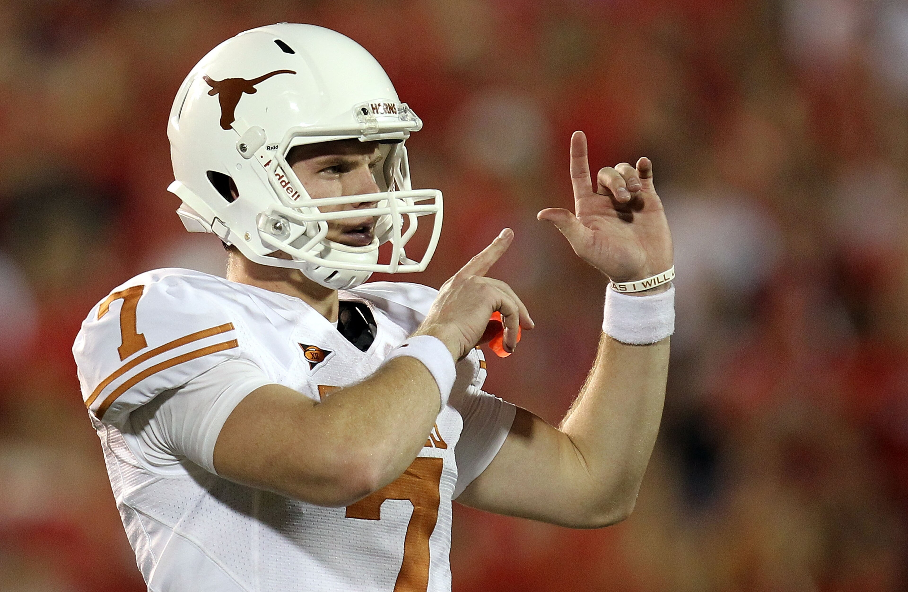 LUBBOCK, TX - SEPTEMBER 18: Quarterback Garrett Gilbert #7 of the Texas Longhorns at Jones AT&T Stadium on September 18, 2010 in Lubbock, Texas. (Photo by Ronald Martinez/Getty Images) LUBBOCK, TX - SEPTEMBER 18: Quarterback Garrett Gilbert #7 of the Texas Longhorns at Jones AT&T Stadium on September 18, 2010 in Lubbock, Texas. (Photo by Ronald Martinez/Getty Images)