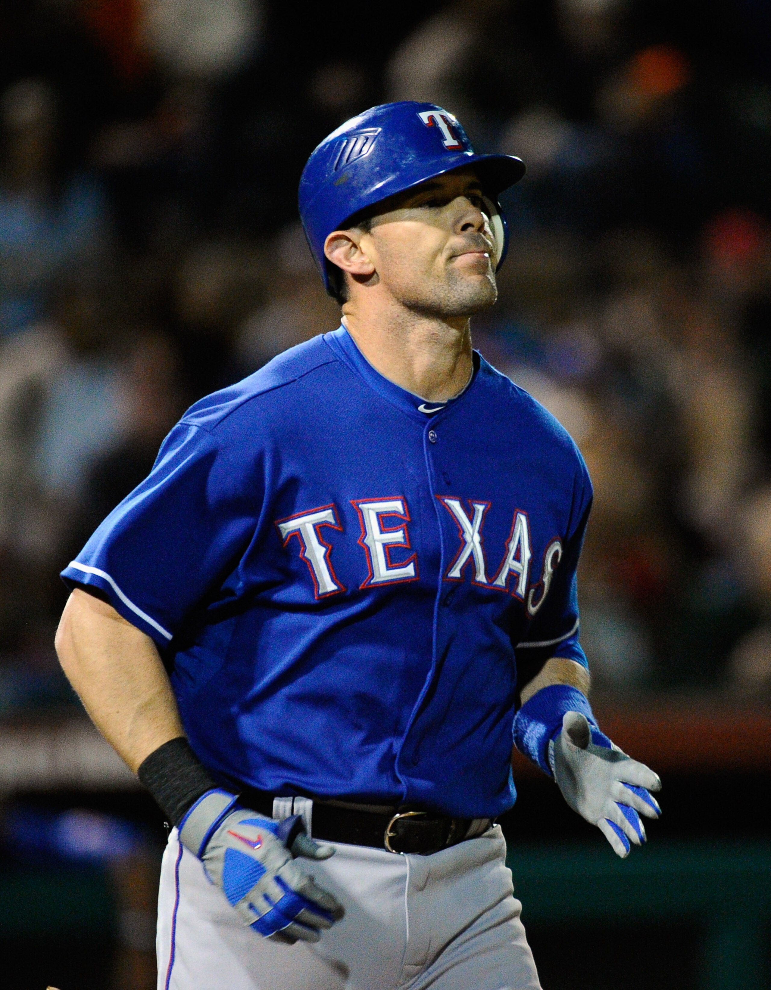 SCOTTSDALE, AZ - MARCH 07:   Michael Young #10 of the Texas Rangers runs to first base against the San Francisco Giants during an exhibition baseball game in the first meeting between the two teams since the World Series during the spring training game at