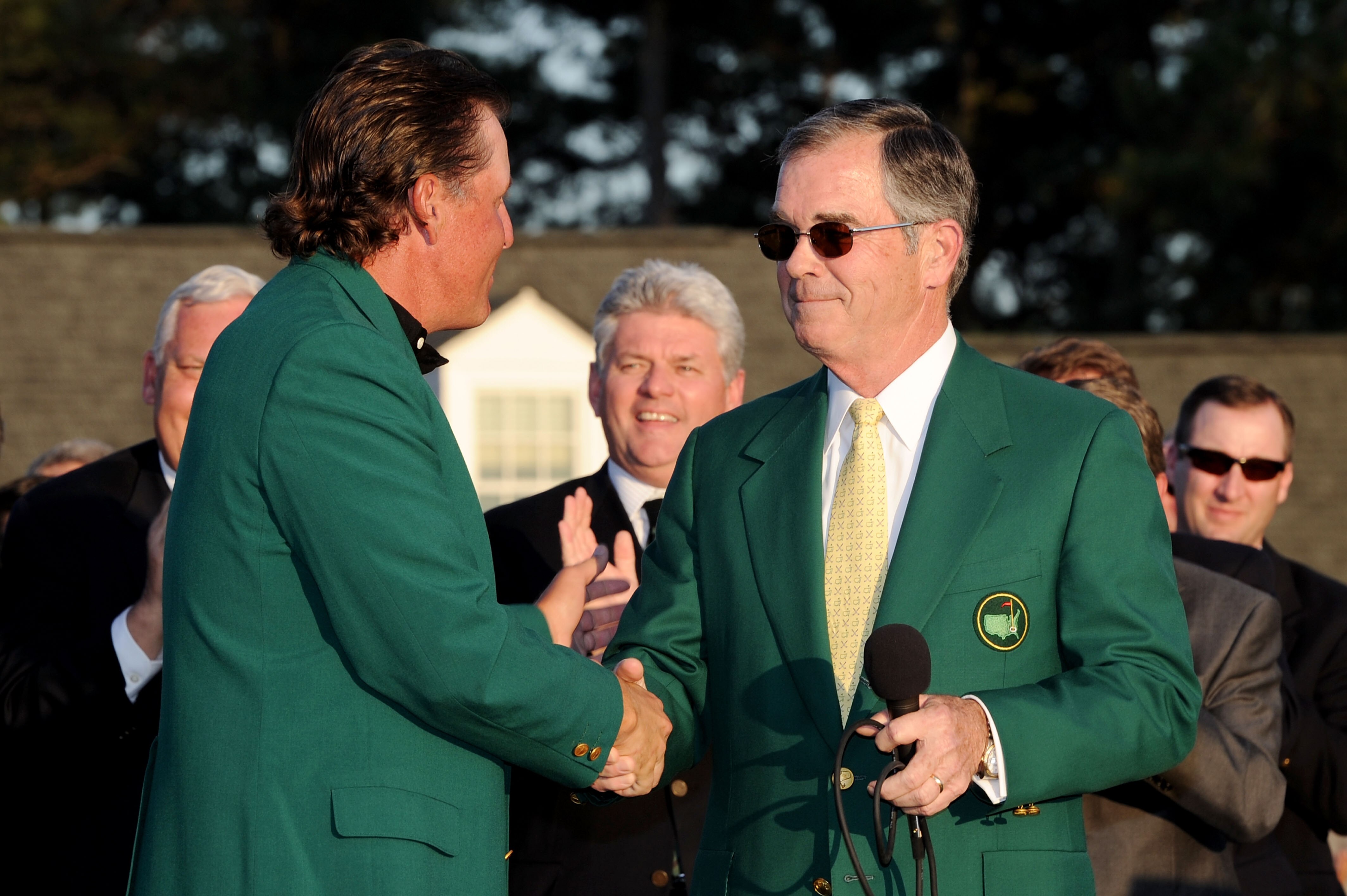 AUGUSTA, GA - APRIL 11:  Augusta National Chairman William Porter 'Billy' Payne (R) congratulates Phil Mickelson during the green jacket presentation after the final round of the 2010 Masters Tournament at Augusta National Golf Club on April 11, 2010 in A