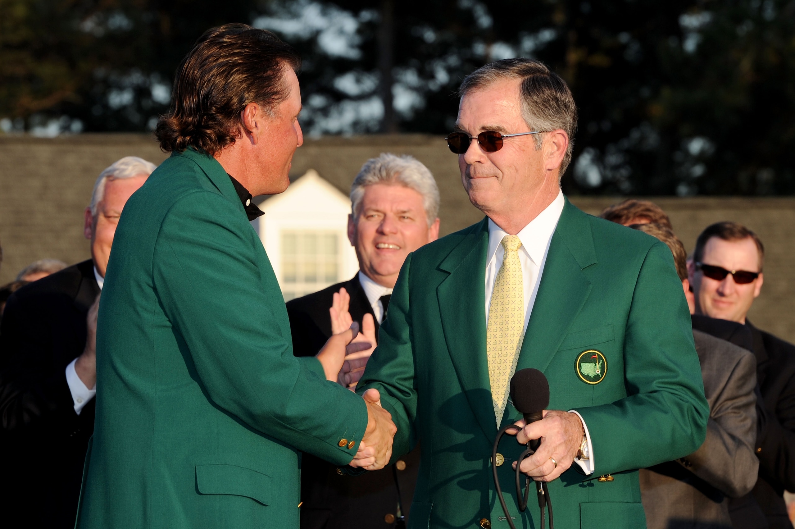 AUGUSTA, GA - APRIL 11:  Augusta National Chairman William Porter 'Billy' Payne (R) congratulates Phil Mickelson during the green jacket presentation after the final round of the 2010 Masters Tournament at Augusta National Golf Club on April 11, 2010 in A