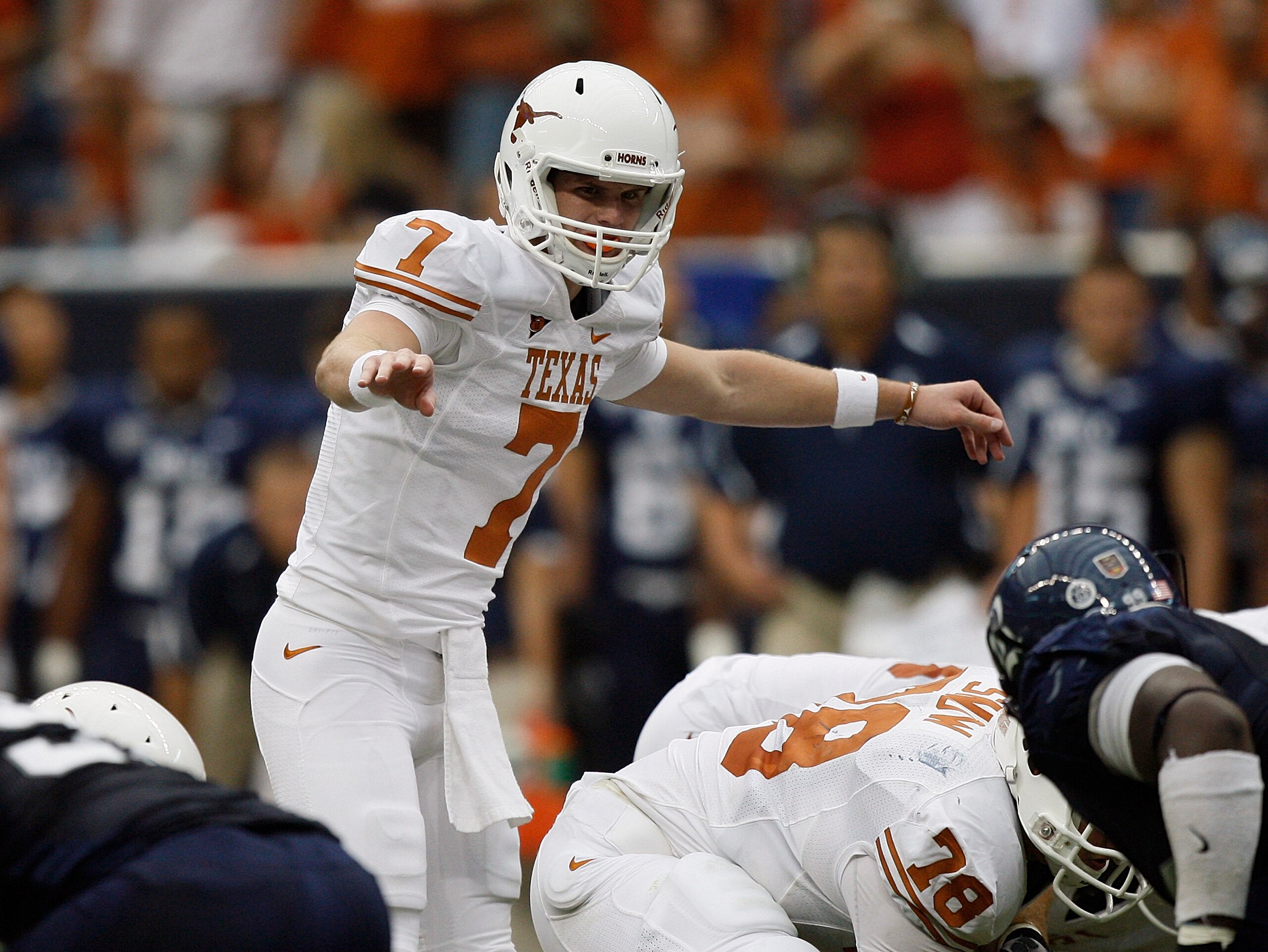 HOUSTON - SEPTEMBER 04:  Quarterback Garrett Gilbert #7 of the Texas Lonhgorns changes the pplay at the line of scrimmage during a football game agasint the Rice Owls at Reliant Stadium on September 4, 2010 in Houston, Texas. Texas beat Rice 34-17.  (Phot