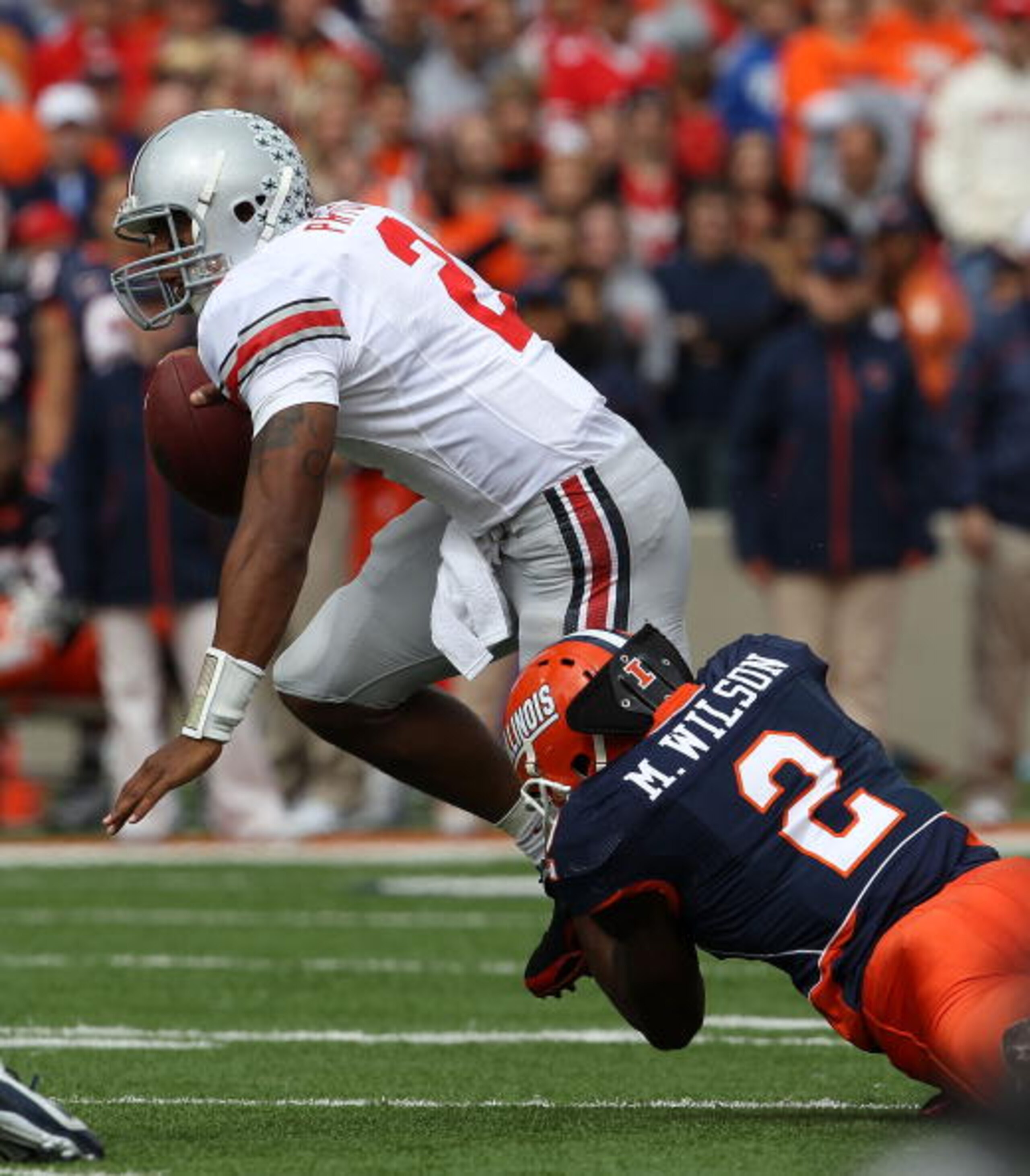 CHAMPAIGN, IL - OCTOBER 02: Terrelle Pryor #2 of the Ohio State Buckeyes is brought down by Martez Wilson #2 of the Illinois Fighting Illini at Memorial Stadium on October 2, 2010 in Champaign, Illinois. Ohio State defeated Illinois 24-13. (Photo by Jonat CHAMPAIGN, IL - OCTOBER 02: Terrelle Pryor #2 of the Ohio State Buckeyes is brought down by Martez Wilson #2 of the Illinois Fighting Illini at Memorial Stadium on October 2, 2010 in Champaign, Illinois. Ohio State defeated Illinois 24-13. (Photo by Jonat