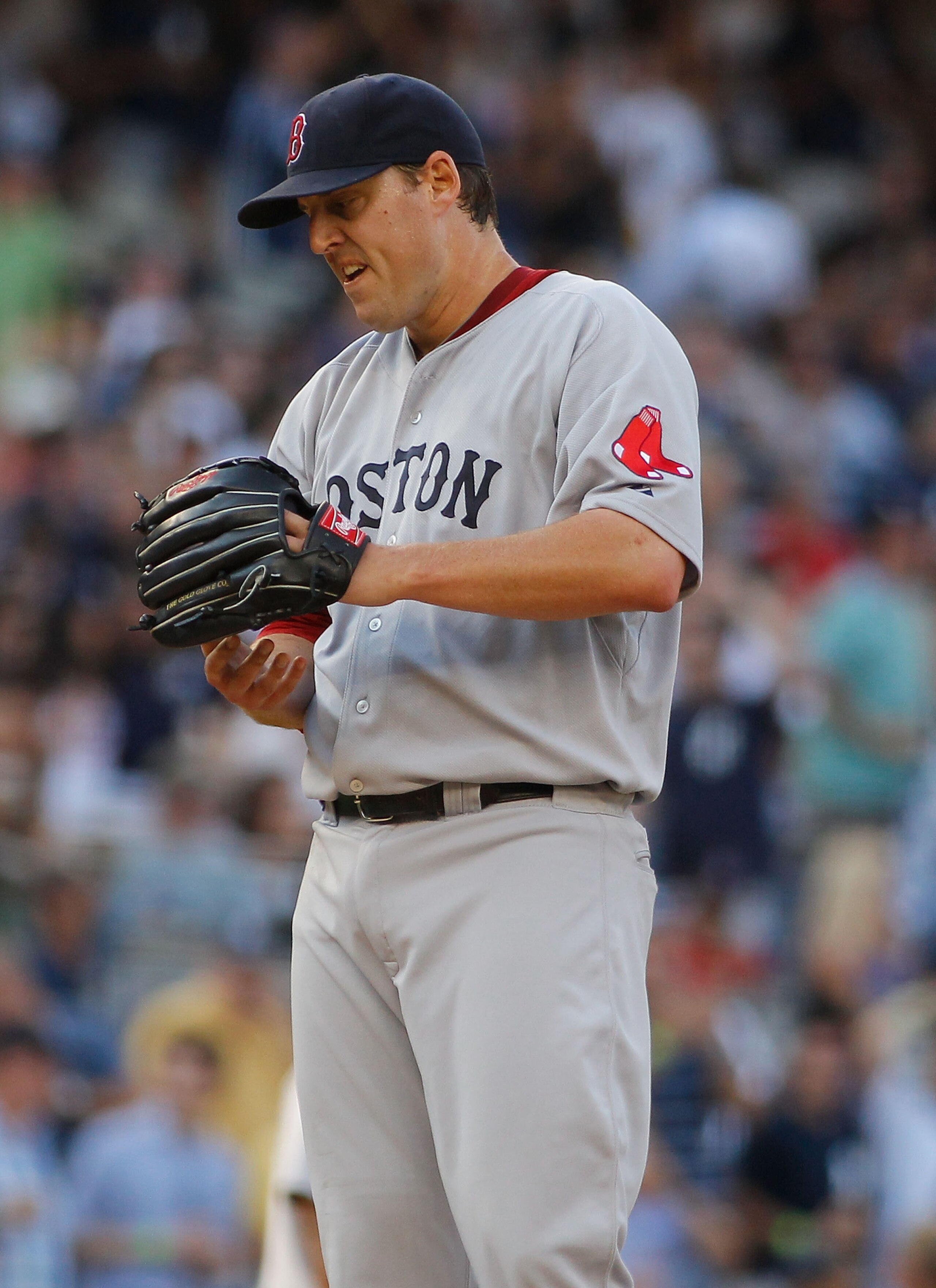 NEW YORK - AUGUST 07:  John Lackey #40 of the Boston Red Sox reacts against the New York Yankees on August 7, 2010 at Yankee Stadium in the Bronx borough of New York City.  (Photo by Mike Stobe/Getty Images)