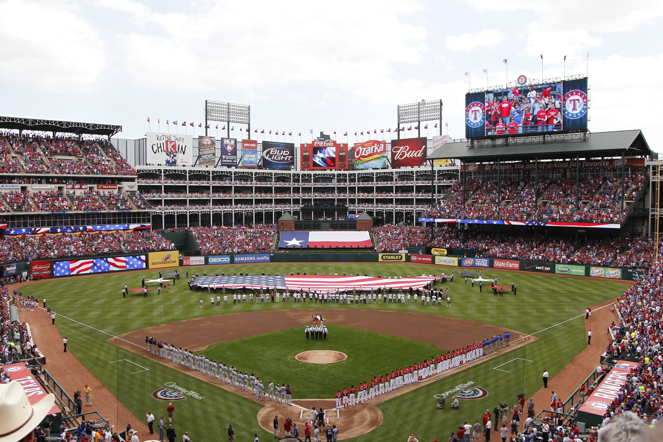 ARLINGTON, TX - APRIL 01:  The Texas Rangers and Boston Red Sox stand during the National Anthem on Opening Day at Rangers Ballpark in Arlington on April 1, 2011 in Arlington, Texas.  (Photo by Tom Pennington/Getty Images)