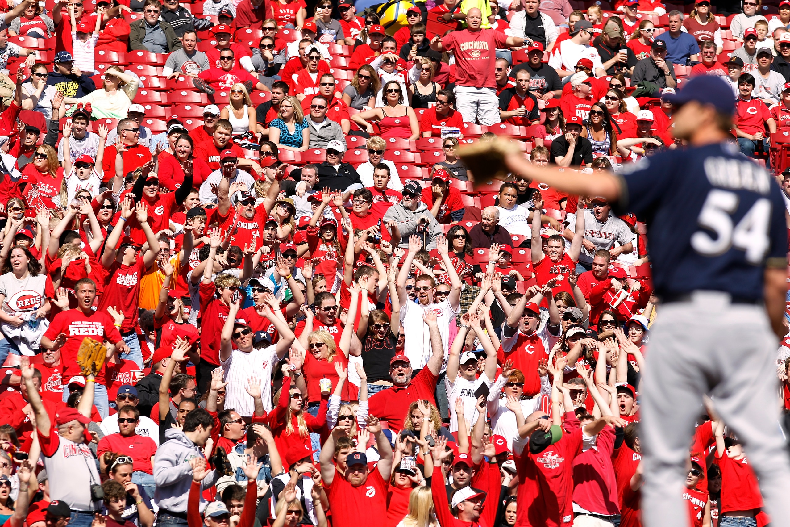 CINCINNATI, OH - APRIL 3: Cincinnati Reds fans cheer late in the game against the Milwaukee Brewers at Great American Ball Park on April 3, 2011 in Cincinnati, Ohio. The Reds won 12-3 to finish off a three-game sweep. (Photo by Joe Robbins/Getty Images)