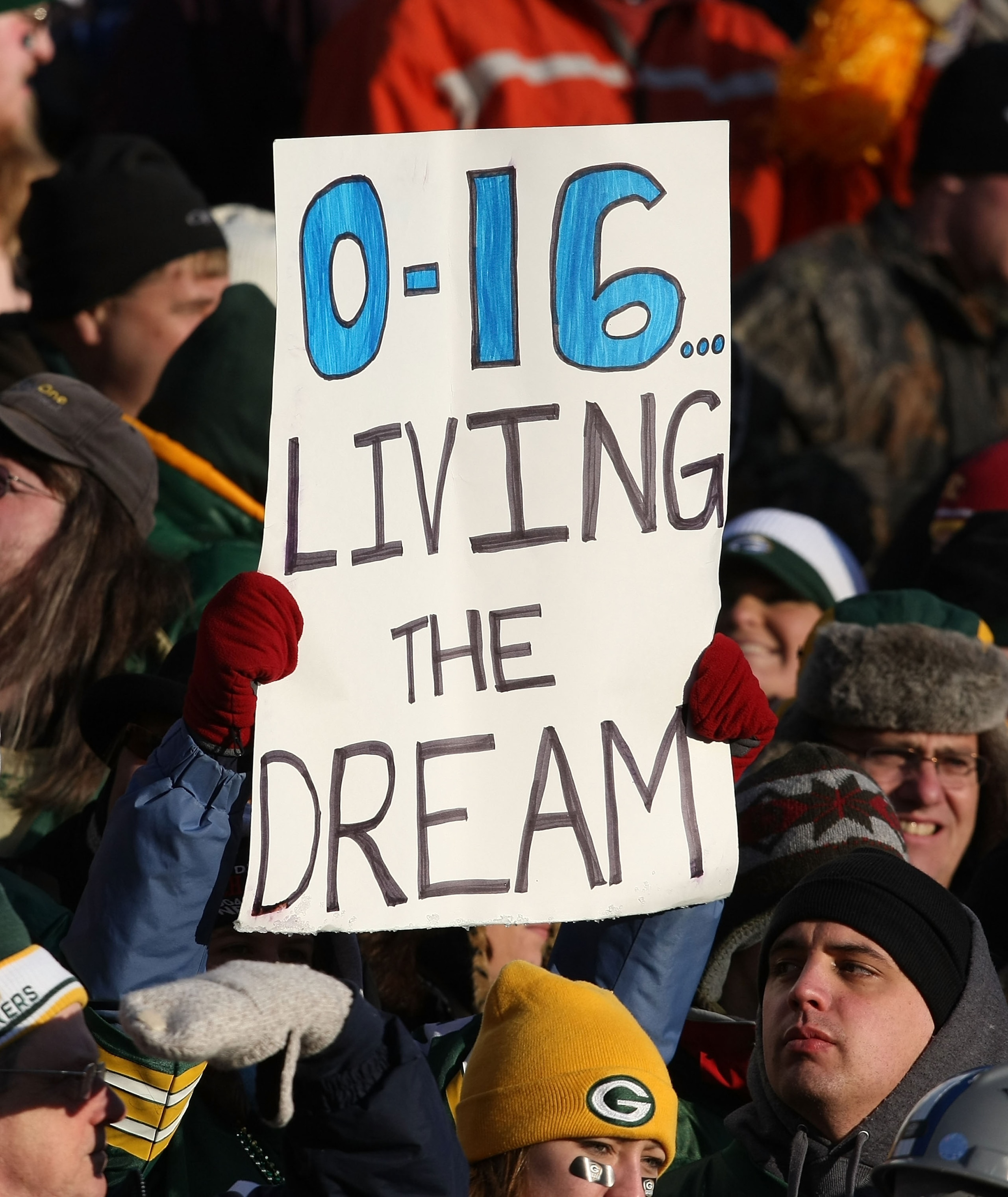 GREEN BAY, WI - DECEMBER 28: Fans hold a sign during a game between the Green Bay Packers and the Detroit Lions on December 28, 2008 at Lambeau Field in Green Bay, Wisconsin. The Packers defeated the Lions 31-21. (Photo by Jonathan Daniel/Getty Images) GREEN BAY, WI - DECEMBER 28: Fans hold a sign during a game between the Green Bay Packers and the Detroit Lions on December 28, 2008 at Lambeau Field in Green Bay, Wisconsin. The Packers defeated the Lions 31-21. (Photo by Jonathan Daniel/Getty Images)