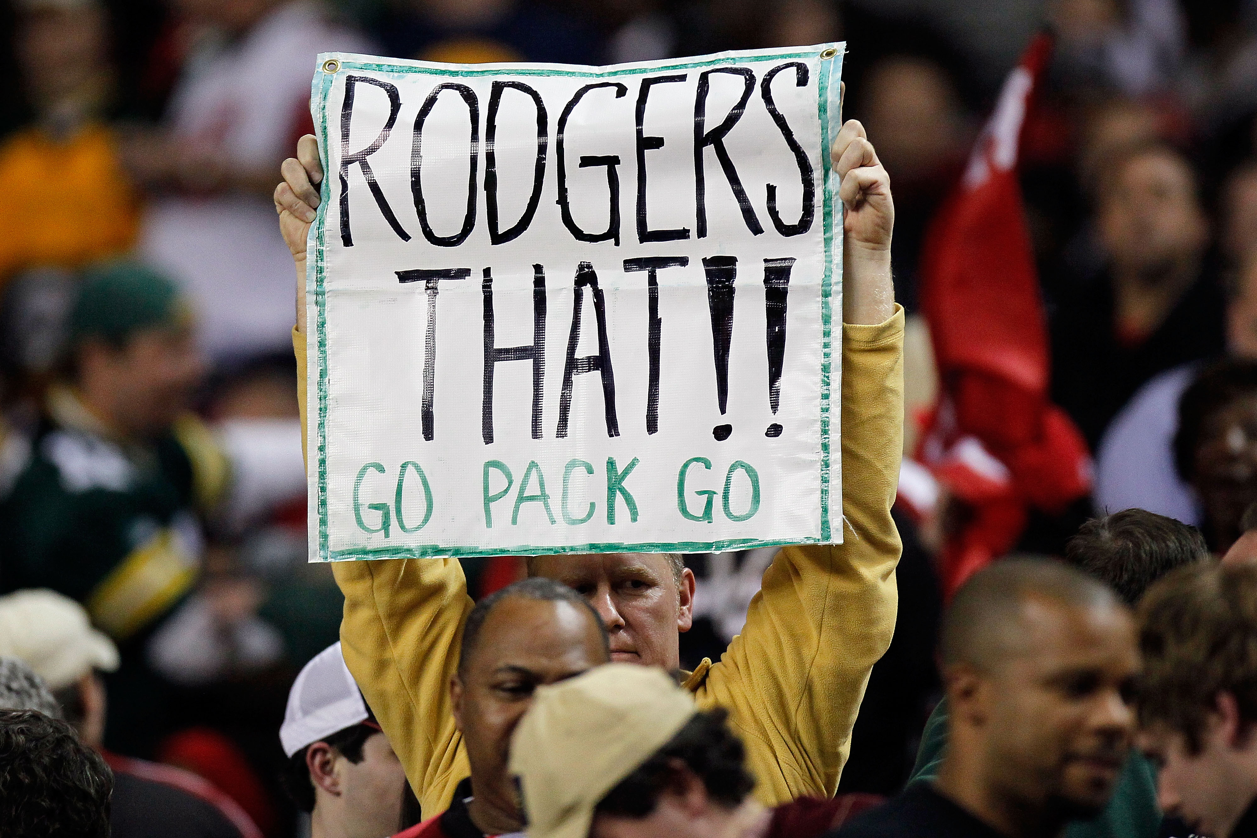 ATLANTA, GA - JANUARY 15:  A fan of the Green Bay Packers holds up a sign which reads 'Rodgers THat Go Pack Go' against the Atlanta Falcons during their 2011 NFC divisional playoff game at Georgia Dome on January 15, 2011 in Atlanta, Georgia.  (Photo by K