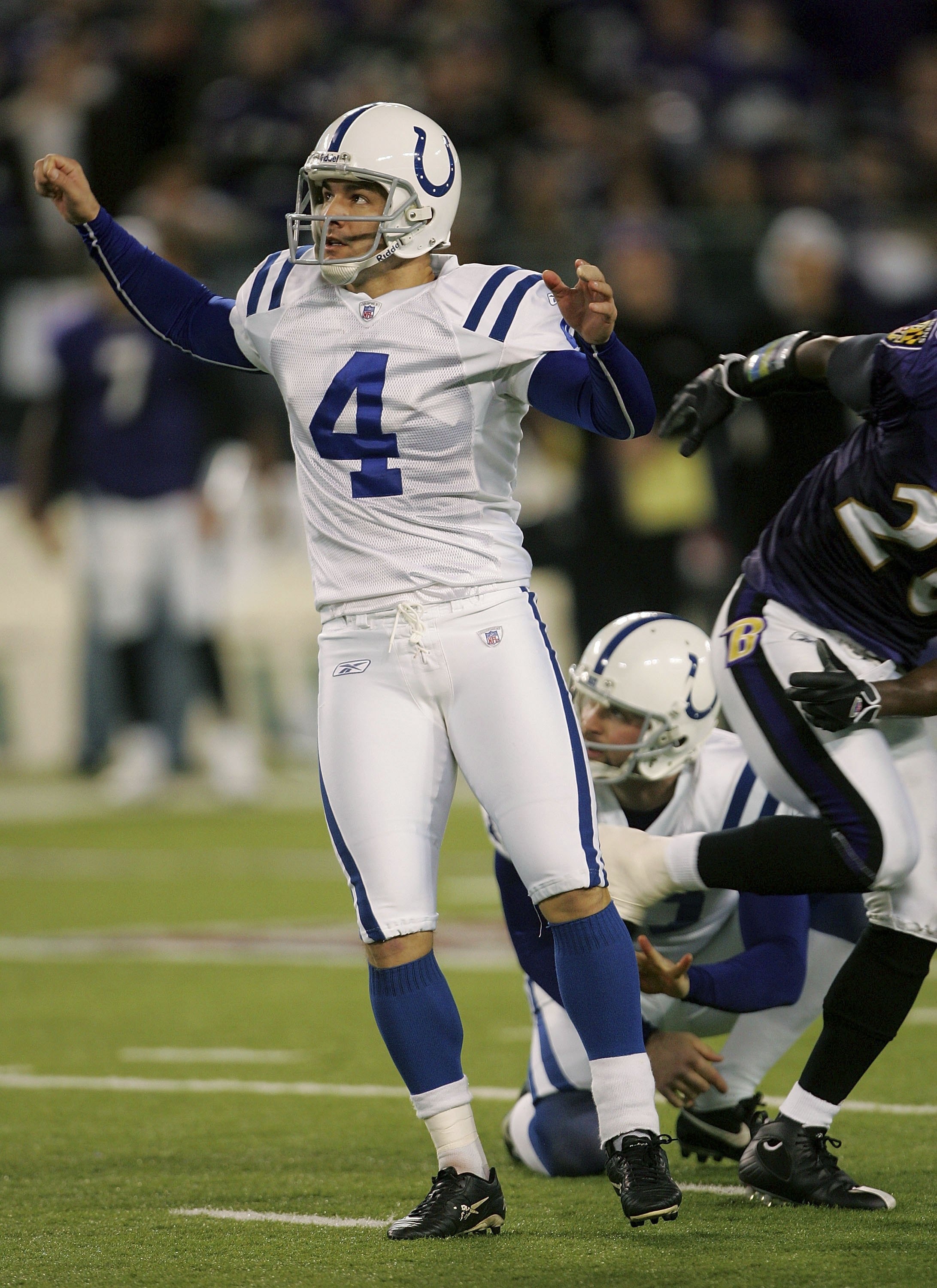 BALTIMORE - JANUARY 13:  Adam Vinatieri #4 of the Indianapolis Colts watches watches a field goal as Hunter Smith #17 holds for him during their AFC Divisional Playoff game against the Baltiomre Ravens on January 13, 2007 at M&T Bank Stadium in Baltimore,