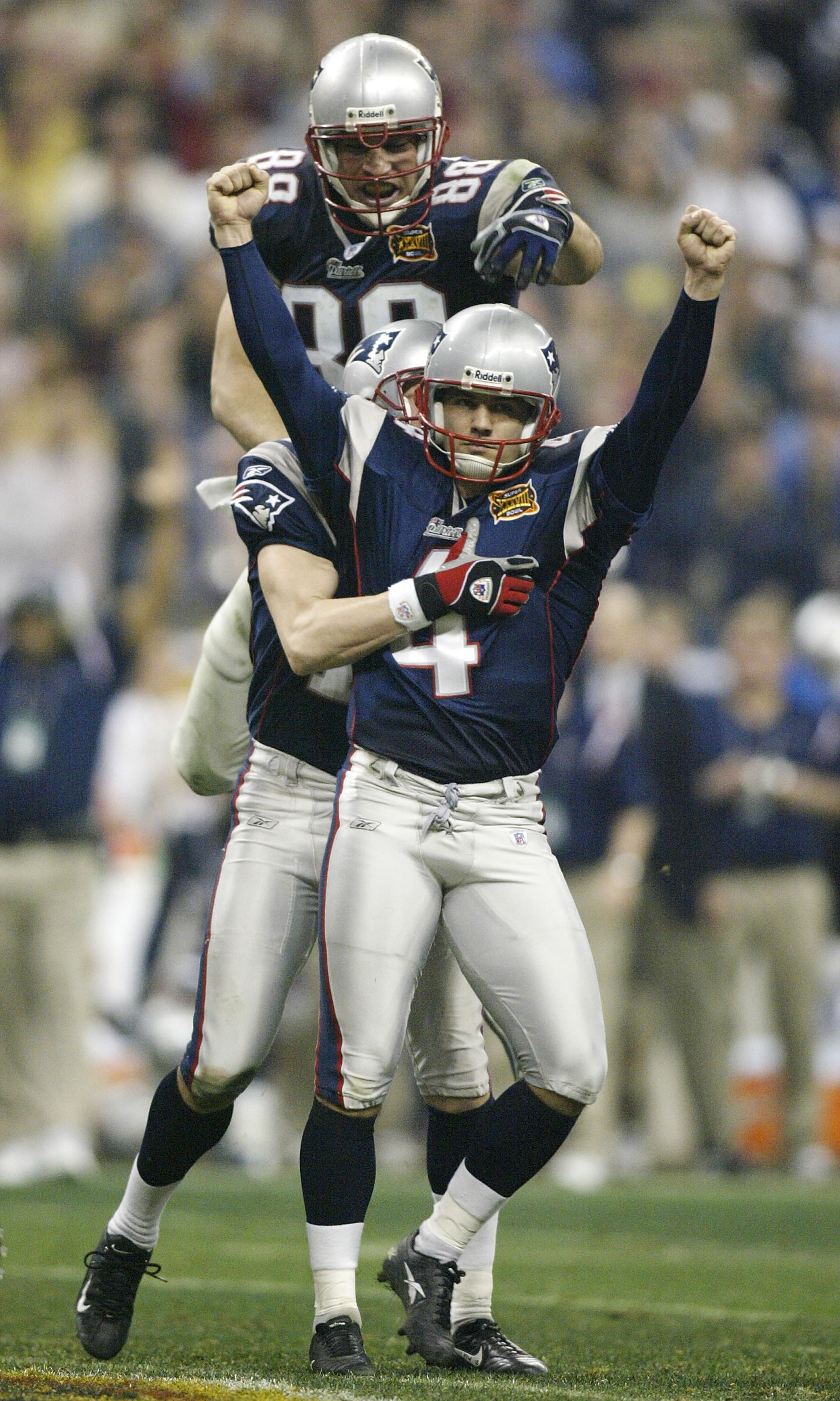 HOUSTON, TX - FEBRUARY 1: Kicker Adam Vinatieri #4 of the New England Patriots celebrates with his teammates Christian Fauria #88 and Ken Walter #13 after kicking a 41-yard game-winning field goal in the forth quarter during Super Bowl XXXVIII against th HOUSTON, TX - FEBRUARY 1: Kicker Adam Vinatieri #4 of the New England Patriots celebrates with his teammates Christian Fauria #88 and Ken Walter #13 after kicking a 41-yard game-winning field goal in the forth quarter during Super Bowl XXXVIII against th