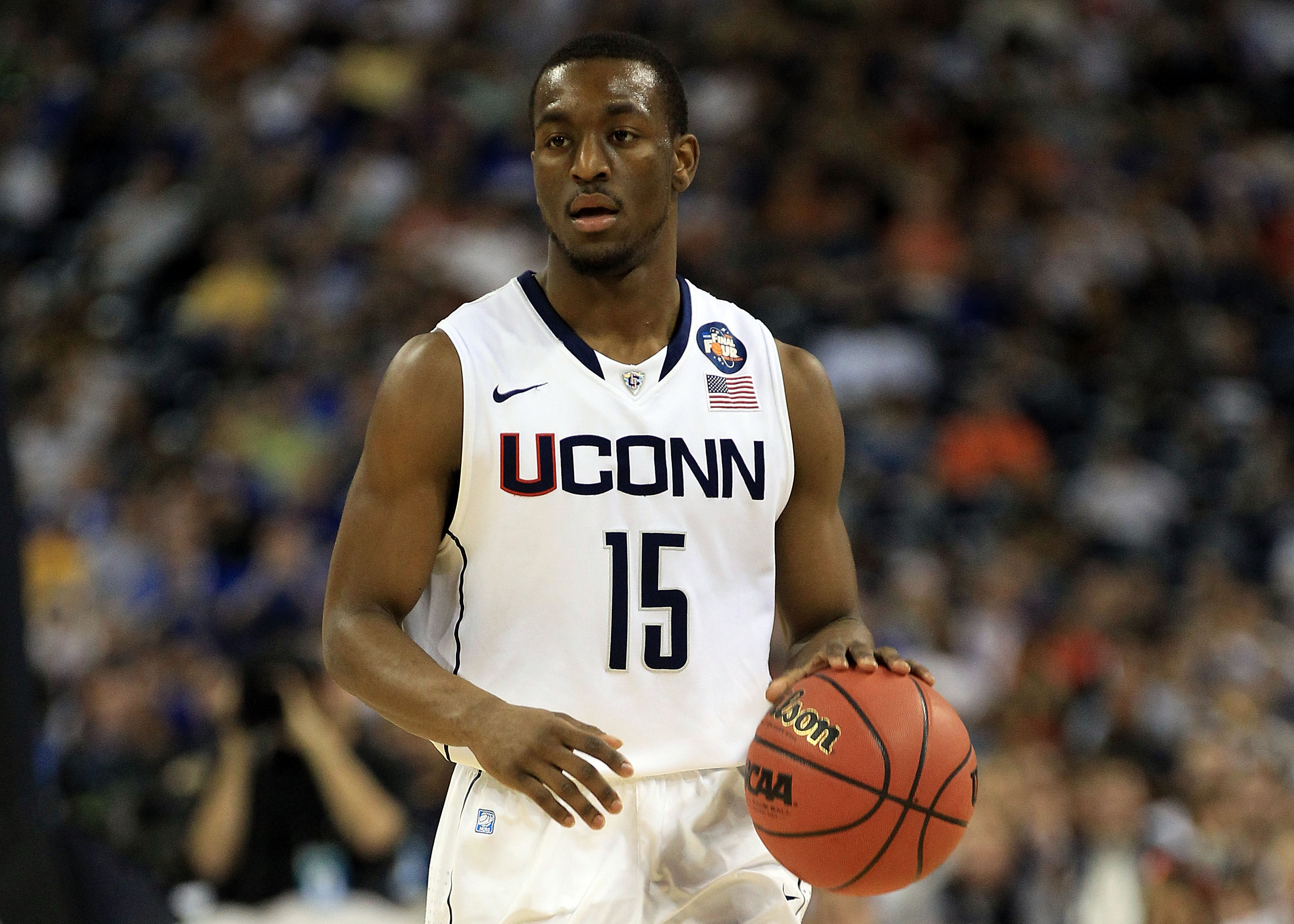 HOUSTON, TX - APRIL 02:  Kemba Walker #15 of the Connecticut Huskies handles the ball against the Kentucky Wildcats during the National Semifinal game of the 2011 NCAA Division I Men's Basketball Championship at Reliant Stadium on April 2, 2011 in Houston