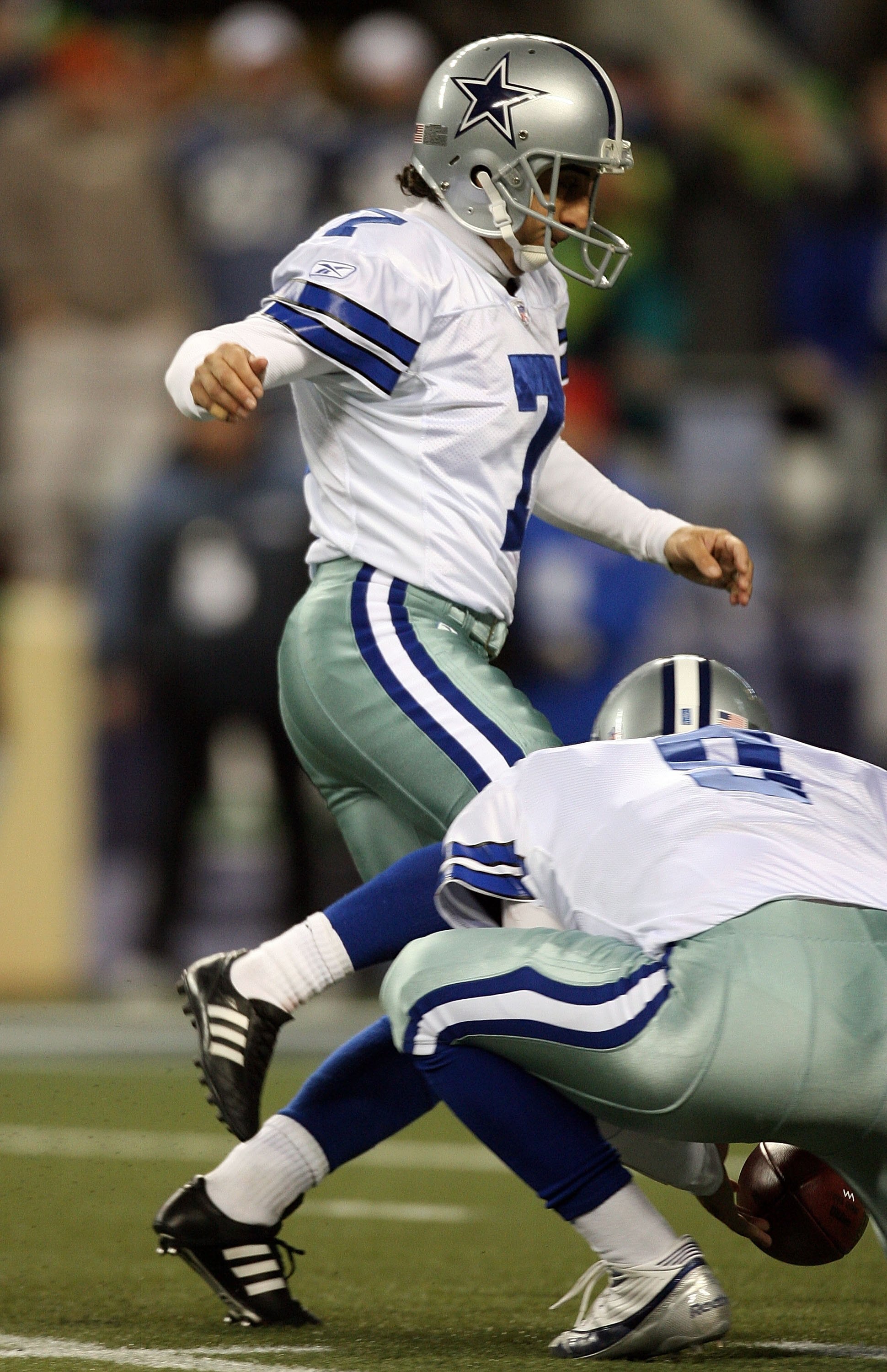 SEATTLE - JANUARY 06:  Martin Gramatica #7 of the Dallas Cowboys attempts a field goal in the fourth quarter of the NFC Wild Card Playoff Game against the Seattle Seahawks on January 6, 2007 at Qwest Field in Seattle, Washington. Tony Romo #9 picks up his