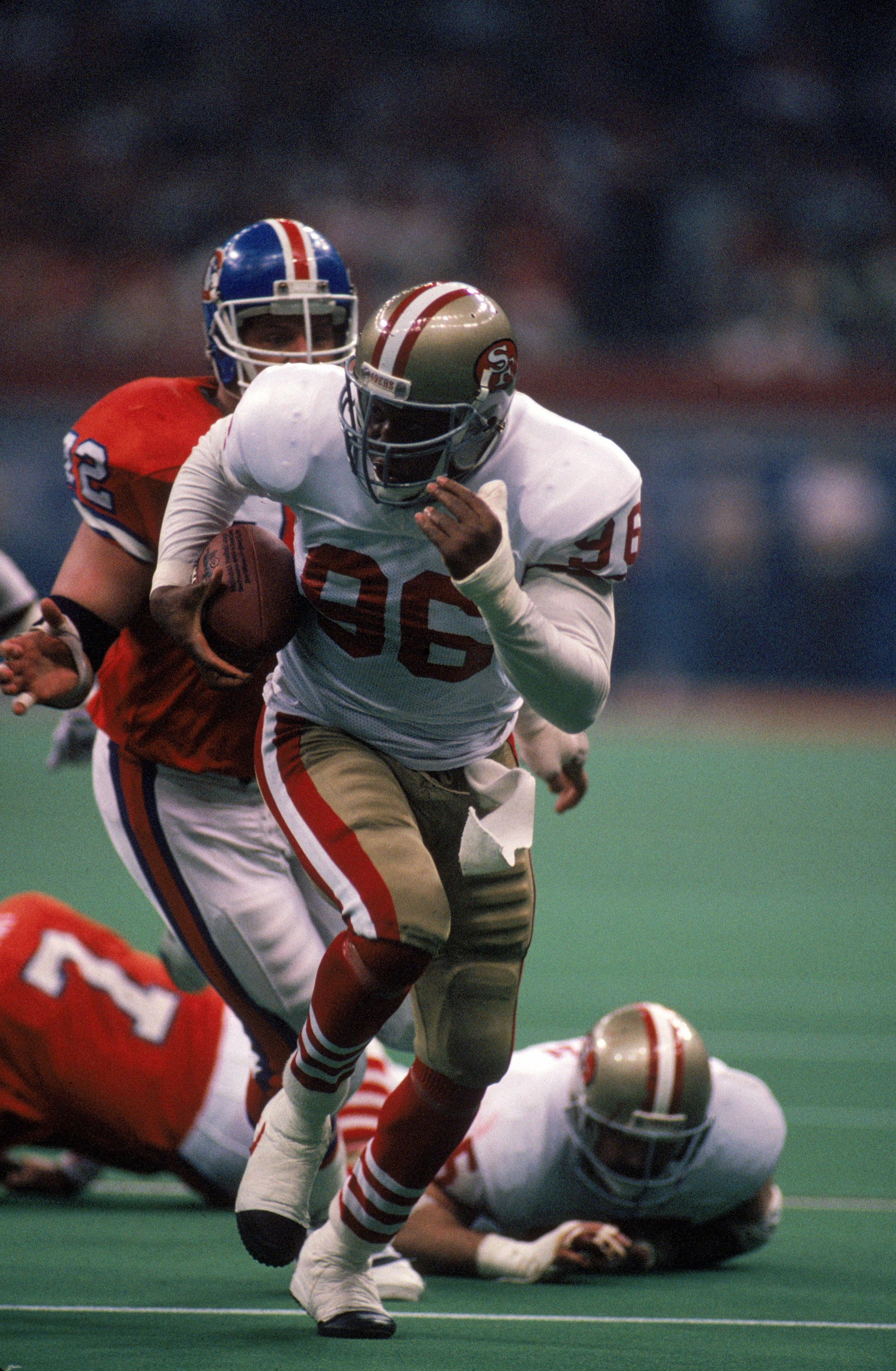 NEW ORLEANS - JANUARY 28:  Defensive end Daniel Stubbs #96 of the San Francisco 49ers returns a fumble in Super Bowl XXIV against the Denver Broncos at Louisiana Superdome on January 28, 1990 in New Orleans, Louisiana.  The 49ers won 55-10.  (Photo by Geo