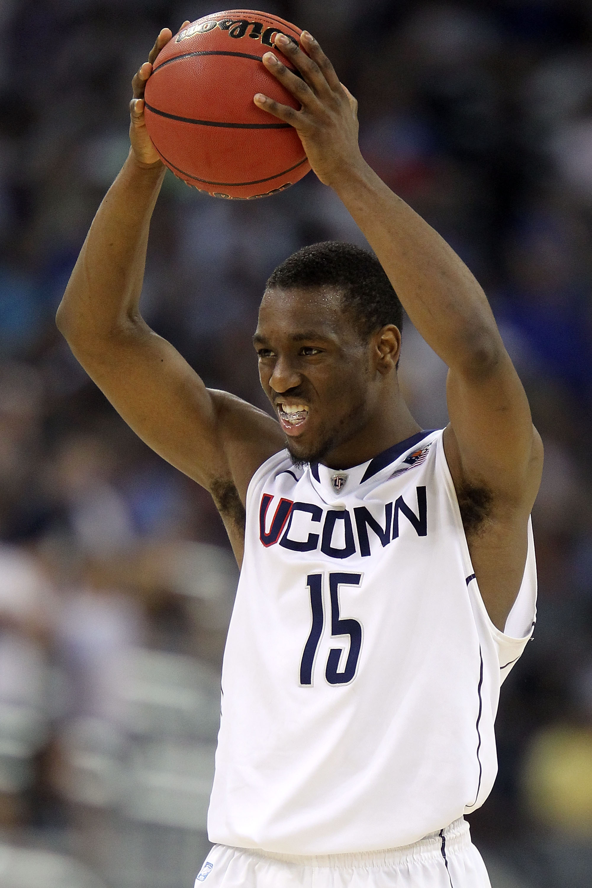 HOUSTON, TX - APRIL 02:  Kemba Walker #15 of the Connecticut Huskies reacts towards the end of the game against the Kentucky Wildcats during the National Semifinal game of the 2011 NCAA Division I Men's Basketball Championship at Reliant Stadium on April