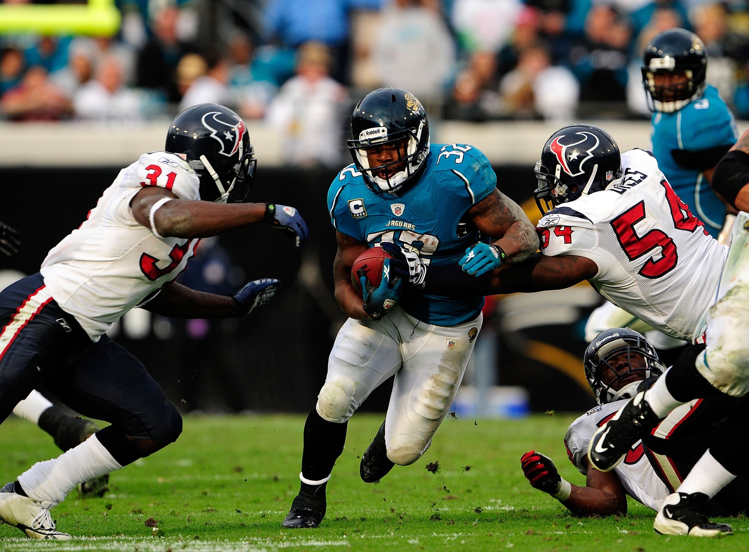 JACKSONVILLE, FL - DECEMBER 06: Maurice Jones-Drew #32 of the Jacksonville Jaguars attempts to run past Bernard Pollard #31 of the Houston Texans during the game at Jacksonville Municipal Stadium on December 6, 2009 in Jacksonville, Florida. (Photo by JACKSONVILLE, FL - DECEMBER 06: Maurice Jones-Drew #32 of the Jacksonville Jaguars attempts to run past Bernard Pollard #31 of the Houston Texans during the game at Jacksonville Municipal Stadium on December 6, 2009 in Jacksonville, Florida. (Photo by