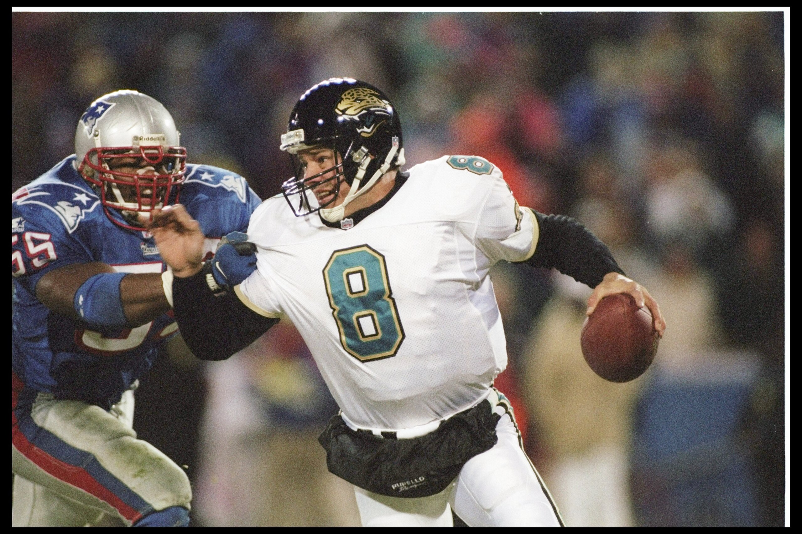 12 Jan 1997: Defensive back Willie McGinest #55 of the New England Patriots rushes quarterback Mark Brunell #8 of the Jacksonville Jaguars during the AFC Championship game played at the Foxboro Stadium in Foxboro, Massachusetts. The Patriots won, 20- 12 Jan 1997: Defensive back Willie McGinest #55 of the New England Patriots rushes quarterback Mark Brunell #8 of the Jacksonville Jaguars during the AFC Championship game played at the Foxboro Stadium in Foxboro, Massachusetts. The Patriots won, 20-