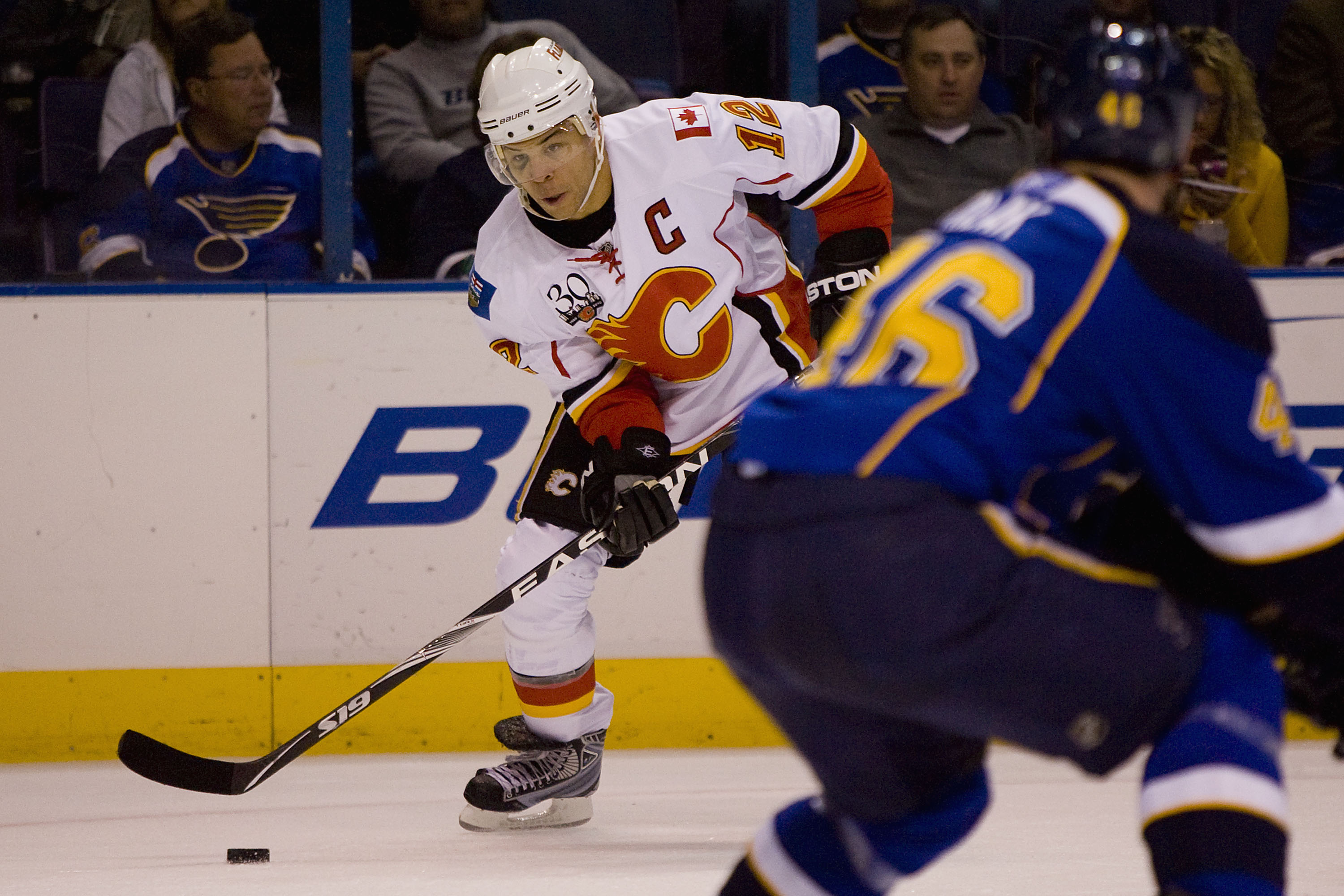 ST. LOUIS, MO. - NOVEMBER 5: Jerome Iginla #12 of the Calgary Flames looks to pass the puck against the St. Louis Blues at the Scottrade Center on November 5, 2009 in St. Louis, Missouri.  (Photo by Dilip Vishwanat/Getty Images)