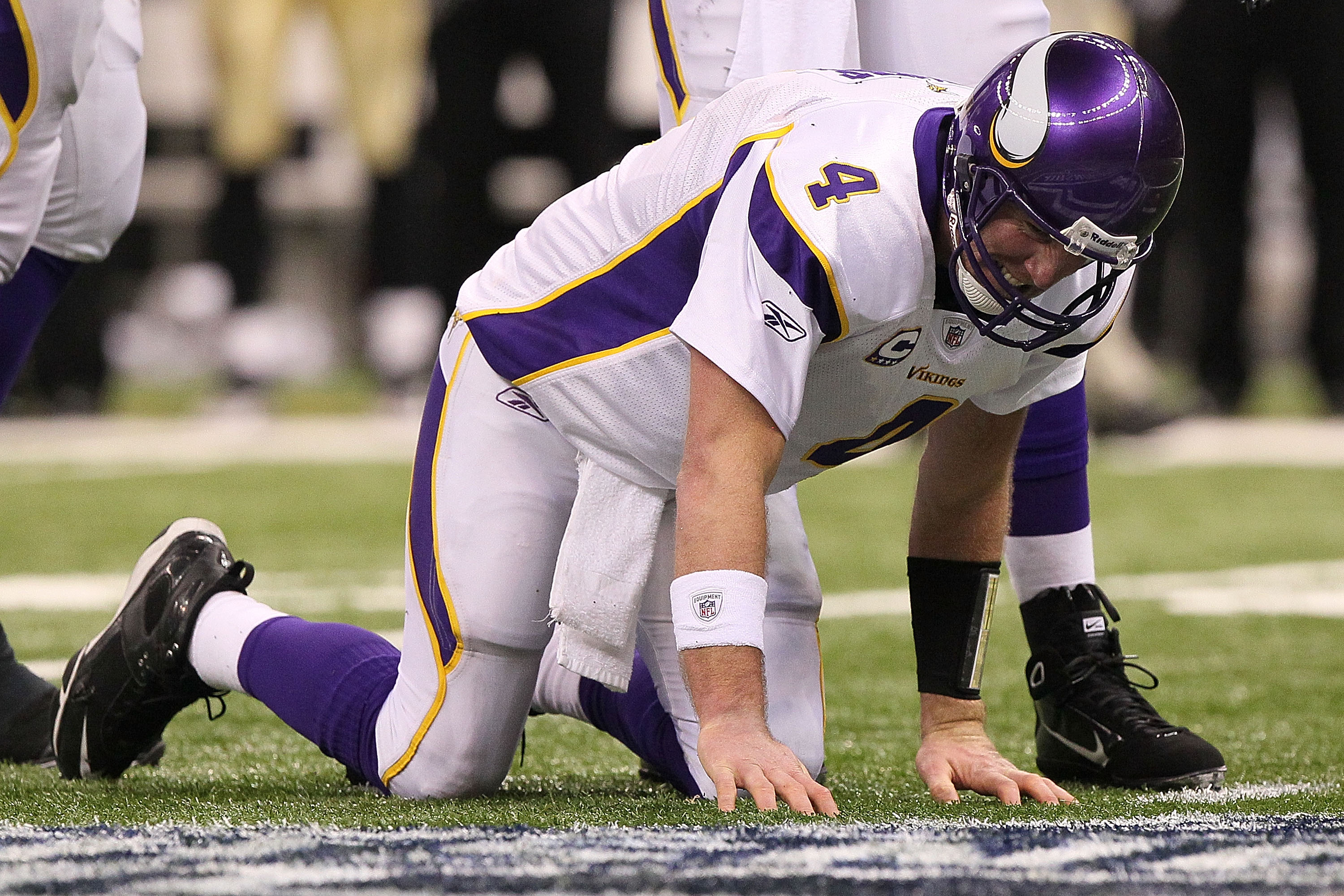NEW ORLEANS - JANUARY 24:  Brett Favre #4 of  the Minnesota Vikings reacts after taking a hard hit in the second half against the New Orleans Saints during the NFC Championship Game at the Louisiana Superdome on January 24, 2010 in New Orleans, Louisiana.