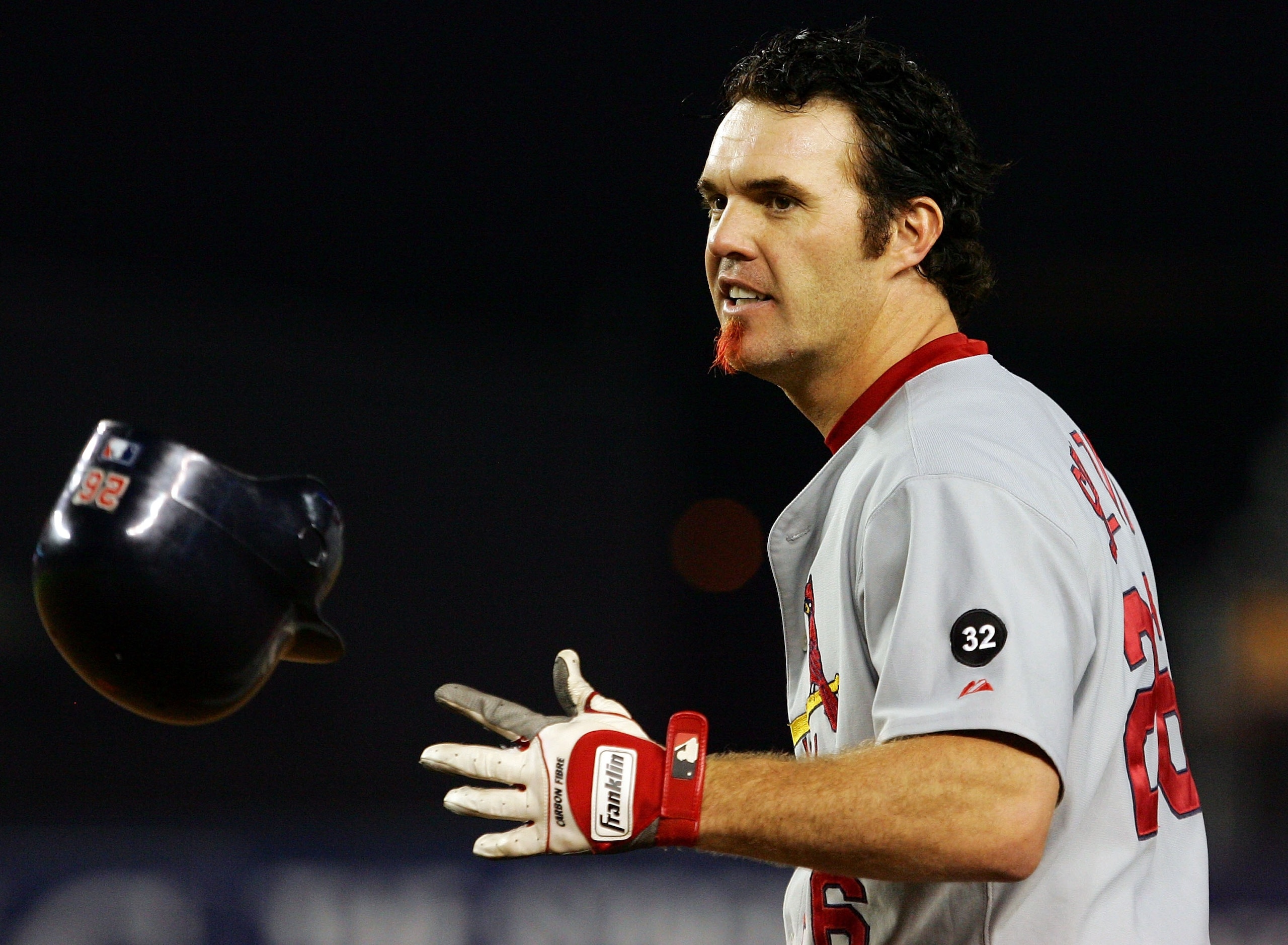 NEW YORK - JUNE 25: Scott Spiezio #26 of the St. Louis Cardinals throws his helmet after grounding out to end the seventh inning with the bases loaded against  the New York Mets during their game on June 25, 2007 at Shea Stadium in the Flushing neighborho