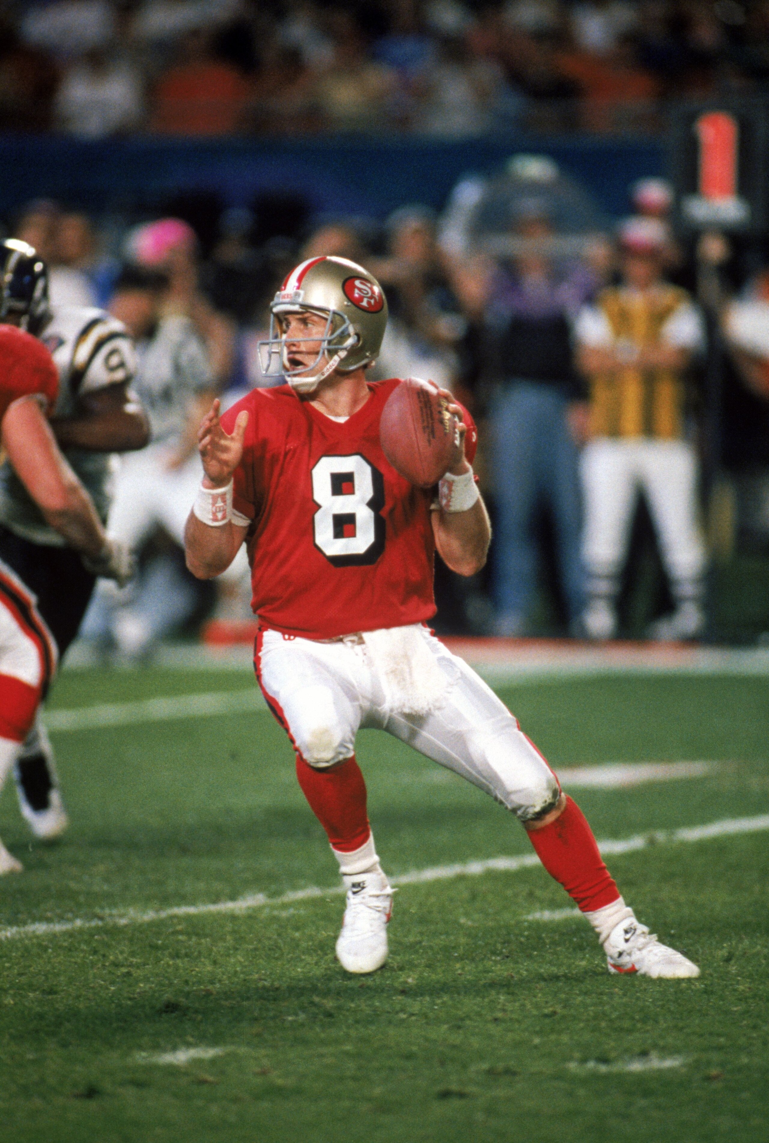 MIAMI - JANUARY 29: Quarterback Steve Young #8 of the San Francisco 49ers drops back to pass during Super Bowl XXIX against the San Diego Chargers at Joe Robbie Stadium on January 29, 1995 in Miami, Florida. The 49ers won 49-26. (Photo by George Rose/Get MIAMI - JANUARY 29: Quarterback Steve Young #8 of the San Francisco 49ers drops back to pass during Super Bowl XXIX against the San Diego Chargers at Joe Robbie Stadium on January 29, 1995 in Miami, Florida. The 49ers won 49-26. (Photo by George Rose/Get