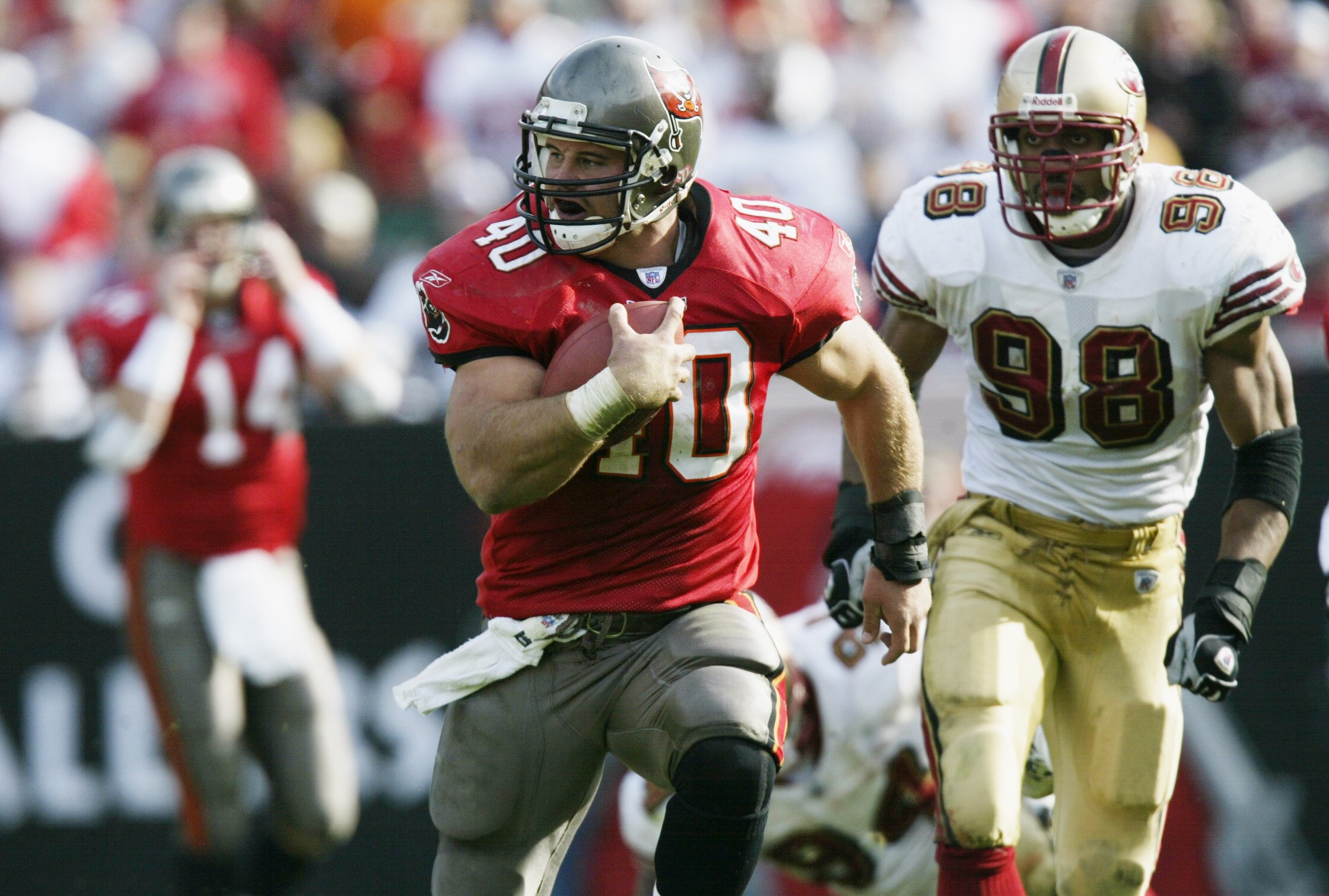 TAMPA, FL - JANUARY 12:  Mike Alstott #40 of the Tampa Bay Buccaneers runs the ball against the San Francisco 49ers during the NFC Divisional Playoff game at Raymond James Stadium on January 12, 2002 in Tampa, Florida. The Buccaneers defeated the 49ers 31