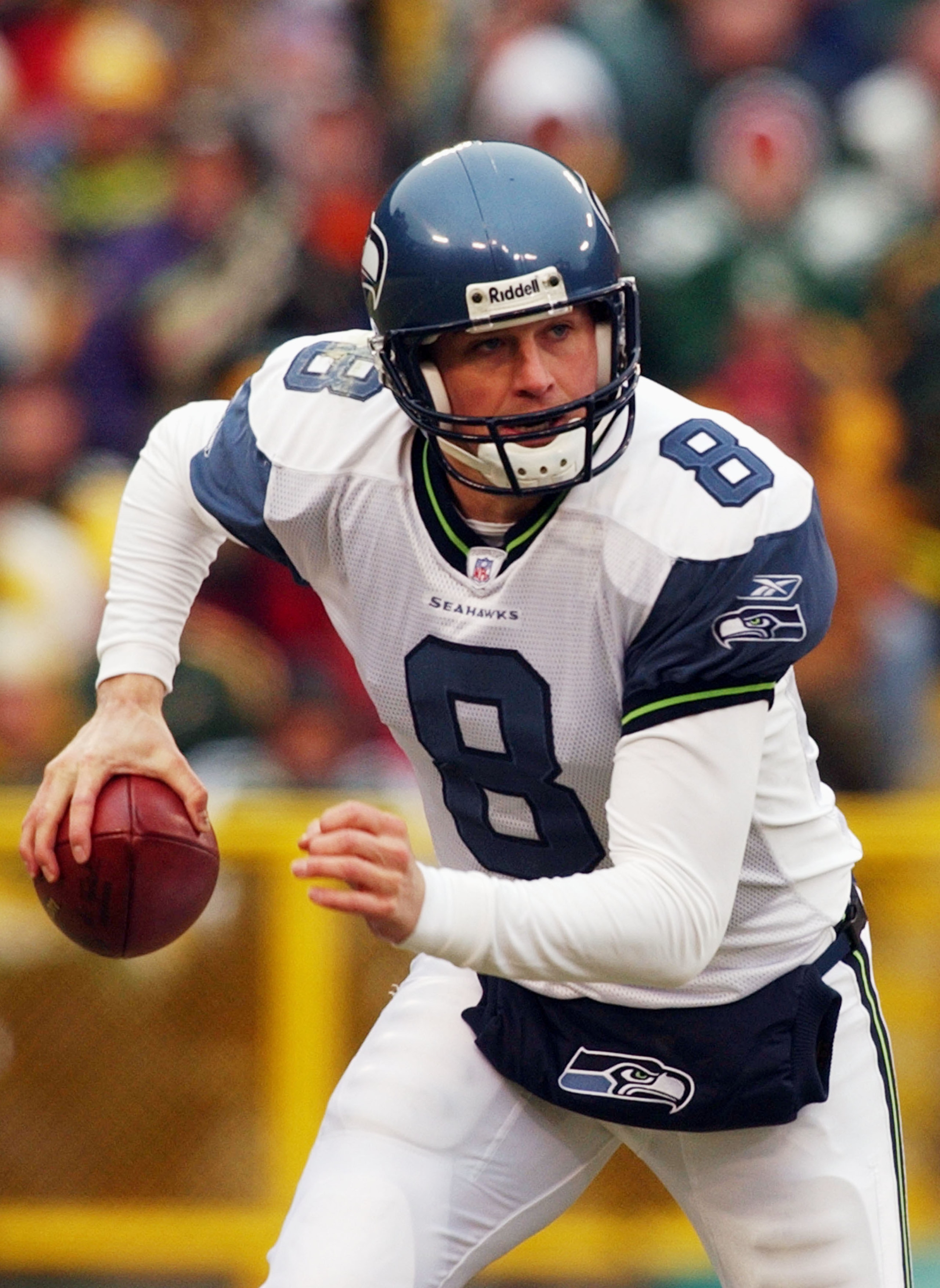 GREEN BAY, WI - JANUARY 4: Quarterback Matt Hasselbeck #8 of the Seattle Seahawks rolls out looking for a receiver against the Green Bay Packers during a game on January 4, 2004 at Lambeau Field in Green Bay, Wisconsin. (Photo by Jonathan Daniel/Getty Im GREEN BAY, WI - JANUARY 4: Quarterback Matt Hasselbeck #8 of the Seattle Seahawks rolls out looking for a receiver against the Green Bay Packers during a game on January 4, 2004 at Lambeau Field in Green Bay, Wisconsin. (Photo by Jonathan Daniel/Getty Im