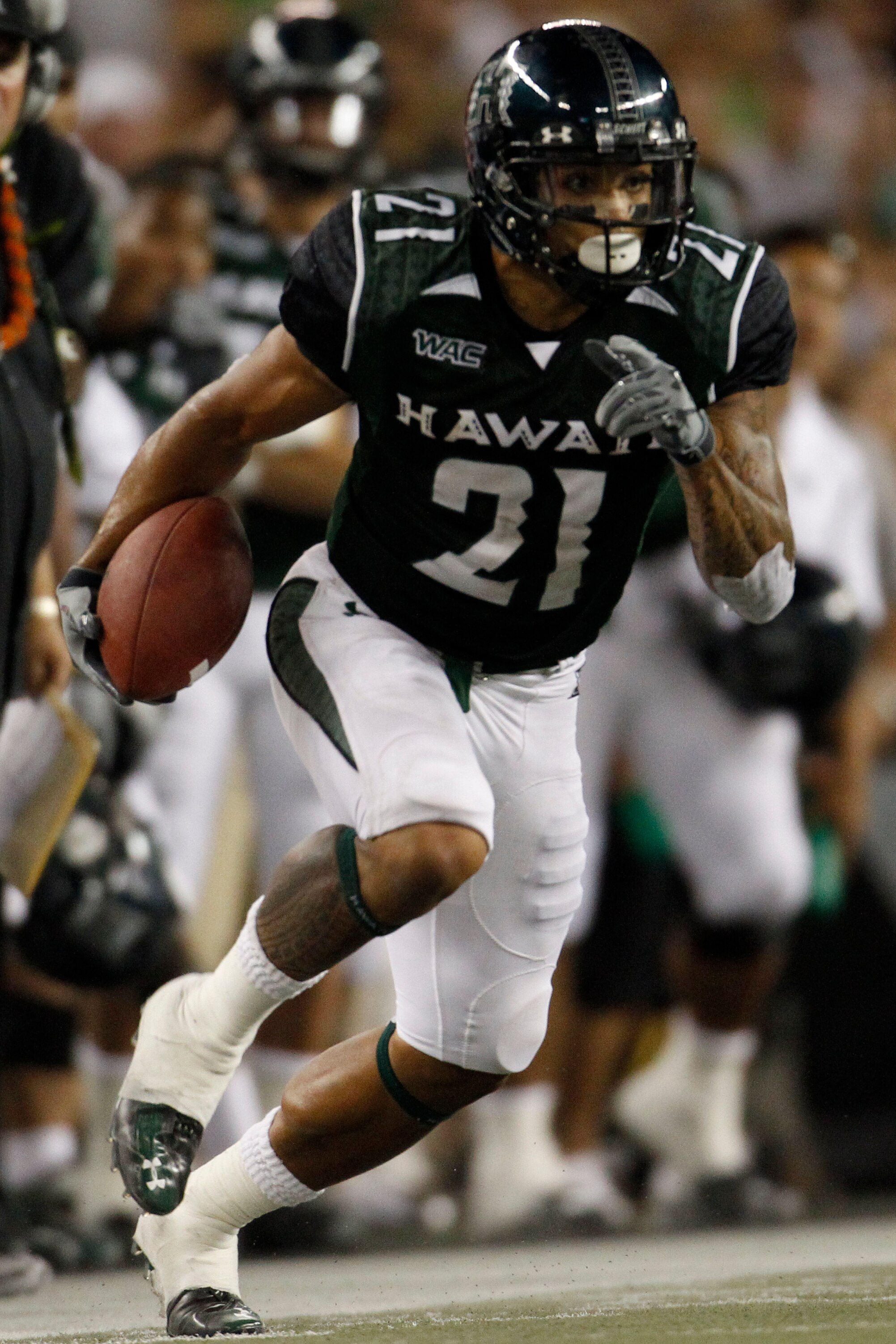 HONOLULU - SEPTEMBER 2: Kealoha Pilares #21 of the University of Hawaii Warriors  runs the ball during second half action at Aloha Stadium September 2, 2010 in Honolulu, Hawaii. (Photo by Kent Nishimura/Getty Images)