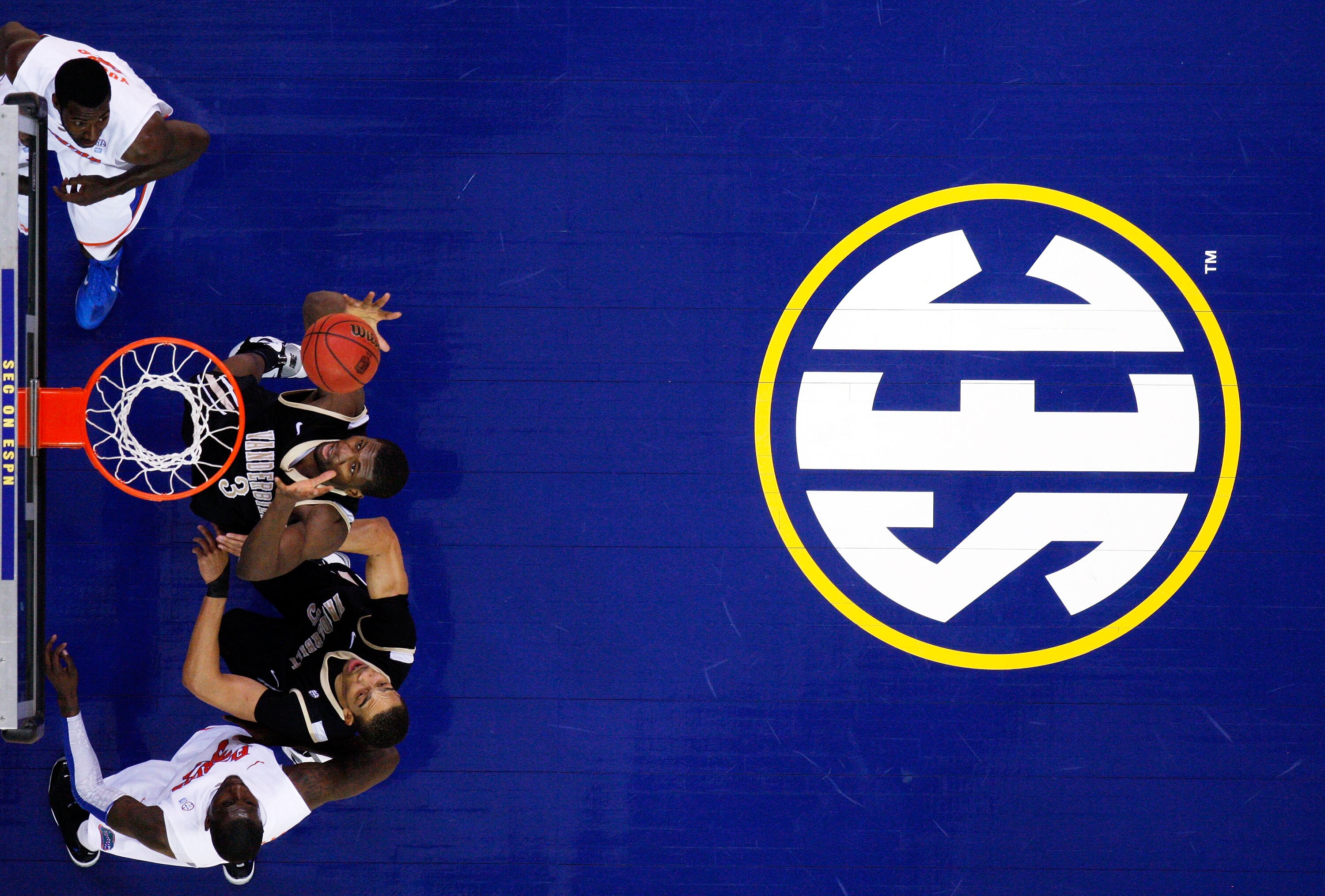 ATLANTA, GA - MARCH 12:  Festus Ezeli #3 of the Vanderbilt Commodores rebounds against the Florida Gators during the semifinals of the SEC Men's Basketball Tournament at Georgia Dome on March 12, 2011 in Atlanta, Georgia.  (Photo by Kevin C. Cox/Getty Ima