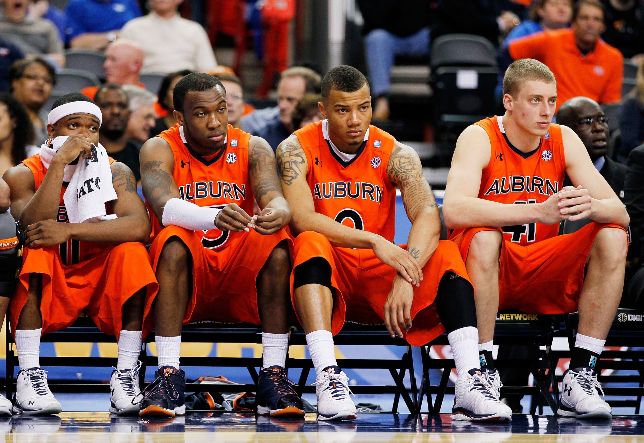 ATLANTA, GA - MARCH 10:  Josh Wallace #11, Tony Neysmith #15, Josh Langford #0 and Rob Chubb #41 of the Auburn Tigers react during their 51 to 69 loss to the Georgia Bulldogs during the first round of the SEC Men's Basketball Tournament at the Georgia Dom