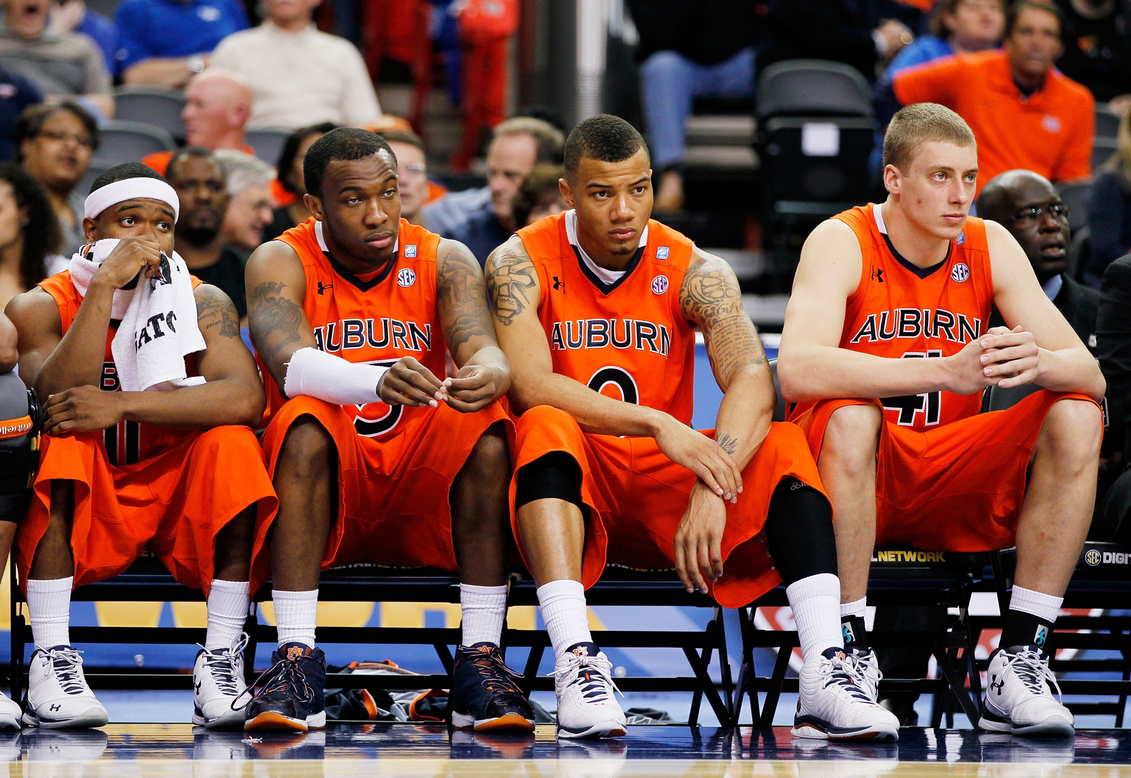 ATLANTA, GA - MARCH 10:  Josh Wallace #11, Tony Neysmith #15, Josh Langford #0 and Rob Chubb #41 of the Auburn Tigers react during their 51 to 69 loss to the Georgia Bulldogs during the first round of the SEC Men's Basketball Tournament at the Georgia Dom