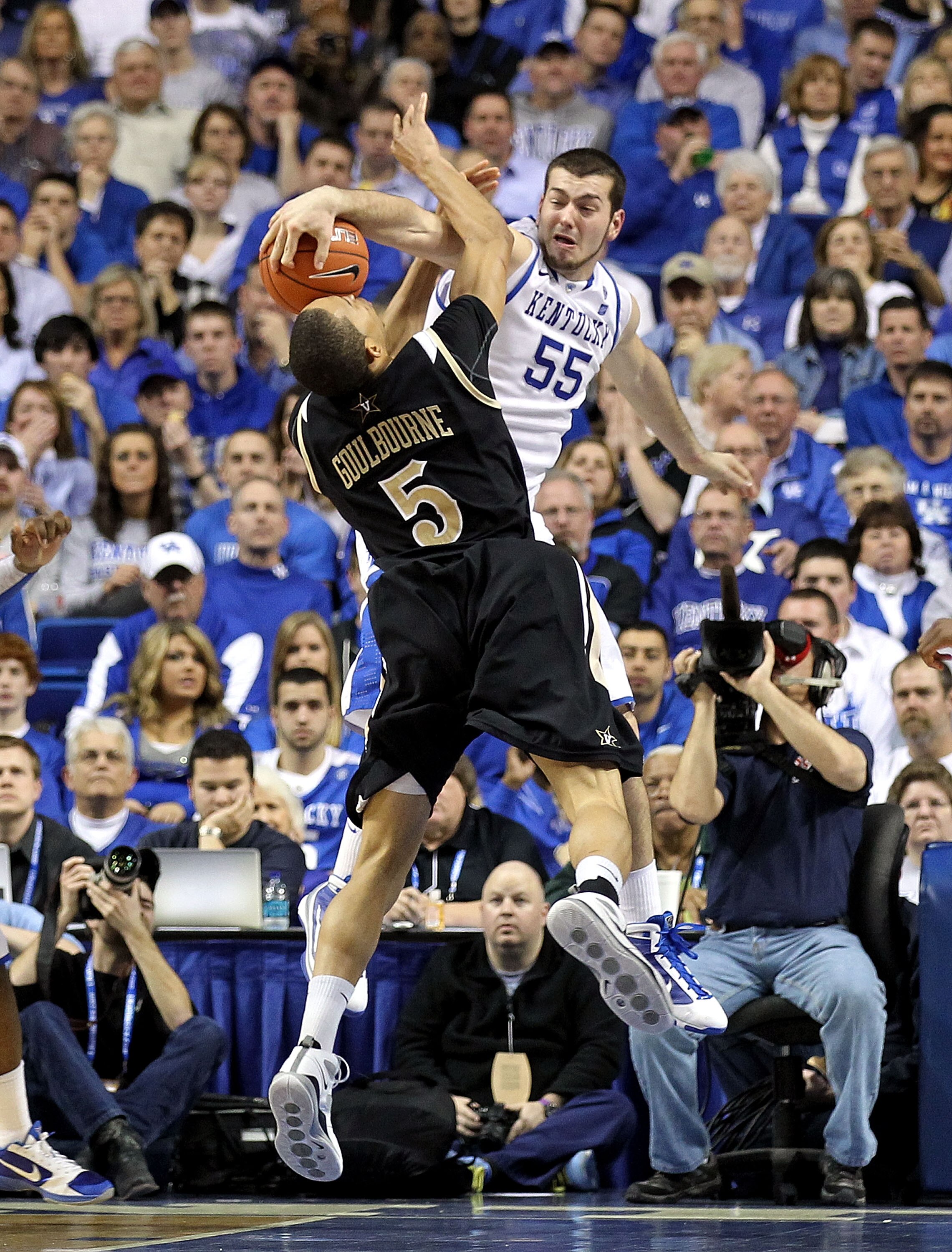 LEXINGTON, KY - MARCH 01:  Josh Harrellson #55 of the Kentucky Wildcats blocks the shot of Lance Goulbourne #5 of the Vanderbilt Commodores  during the SEC game at Rupp Arena on March 1, 2011 in Lexington, Kentucky.  (Photo by Andy Lyons/Getty Images)