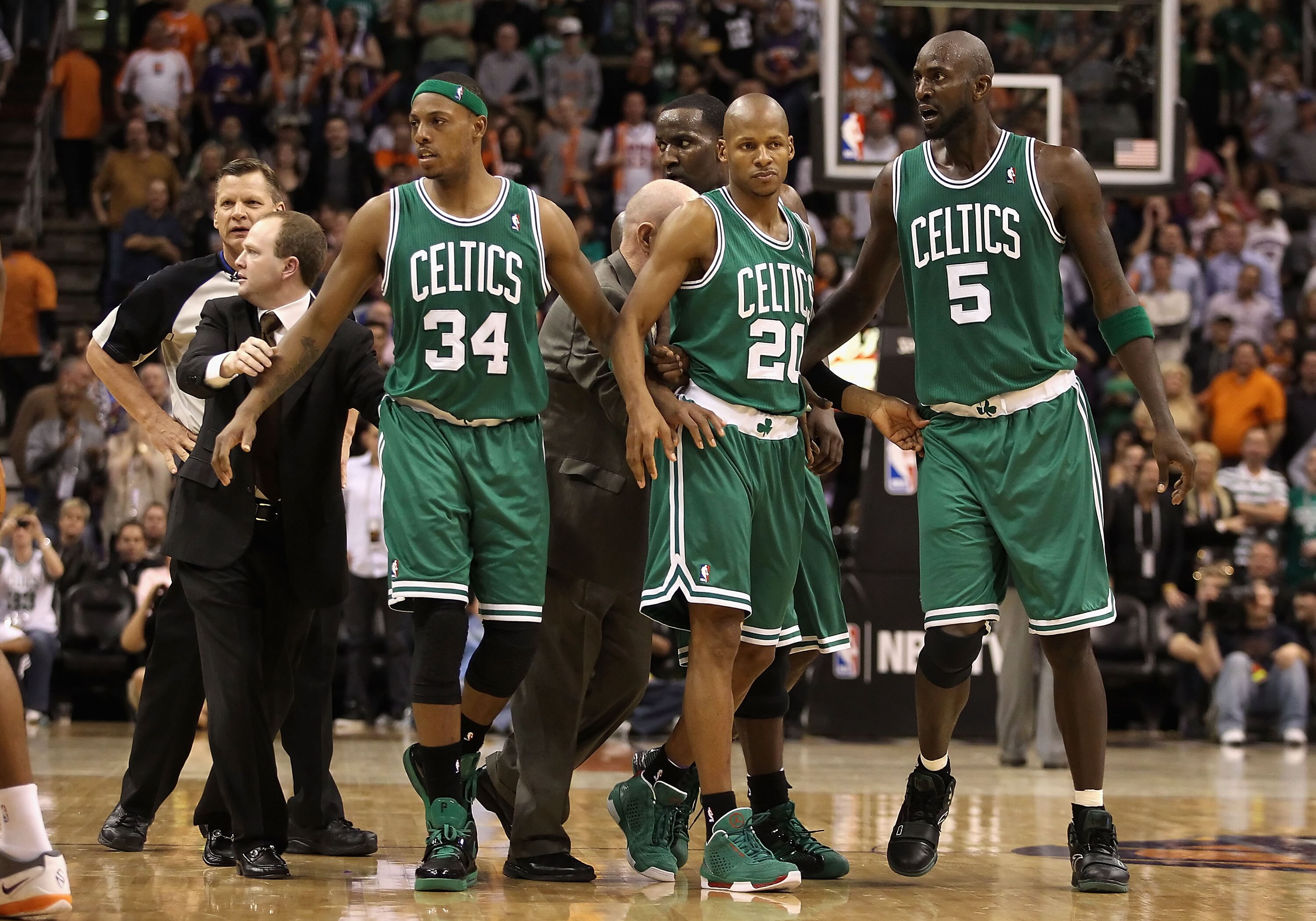 PHOENIX, AZ - JANUARY 28:  Assistant coach Lawrence Frank of the Boston Celtics walks Paul Pierce #34, Ray Allen #20 and Kevin Garnett #5 back to the bench after an altercation against the Phoenix Suns during the NBA game at US Airways Center on January 2
