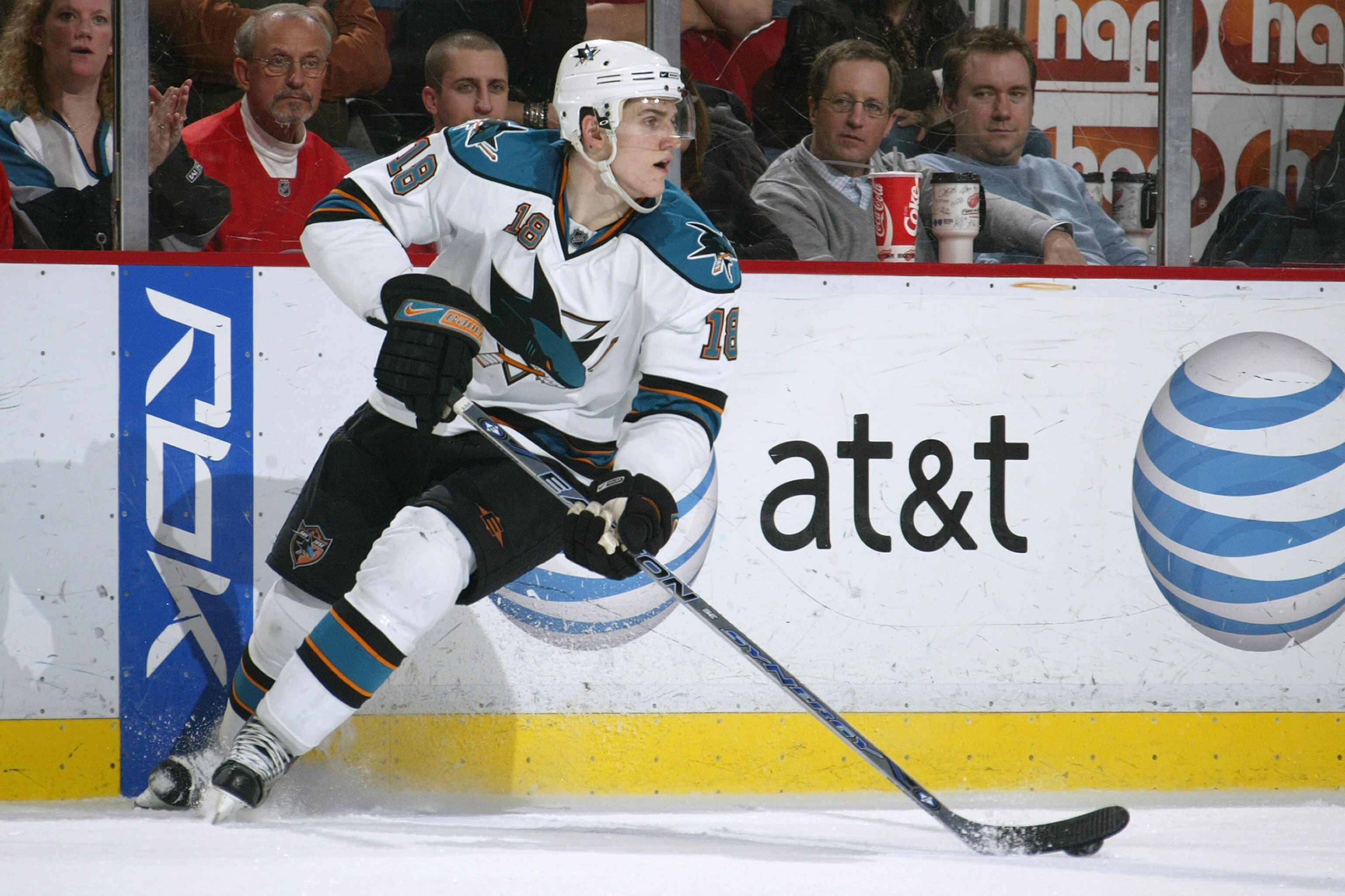 DETROIT - FEBRUARY 29:  Matt Carle #18 of the San Jose Sharks skates with the puck against the Detroit Red Wings during their NHL game at Joe Louis Arena on February 29, 2008 in Detroit, Michigan. (Photo by Dave Sandford/Getty Images)