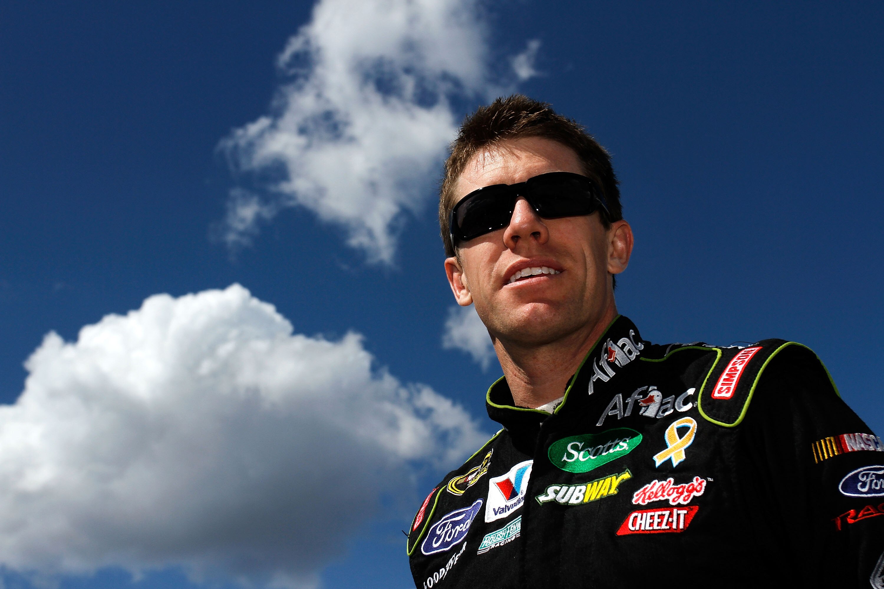 MARTINSVILLE, VA - APRIL 02:  Carl Edwards, driver of the #99 Aflac Ford, stands on the grid during qualifying for the NASCAR Sprint Cup Series Goody's Fast Relief 500 at Martinsville Speedway on April 2, 2011 in Martinsville, Virginia.  (Photo by Jason S