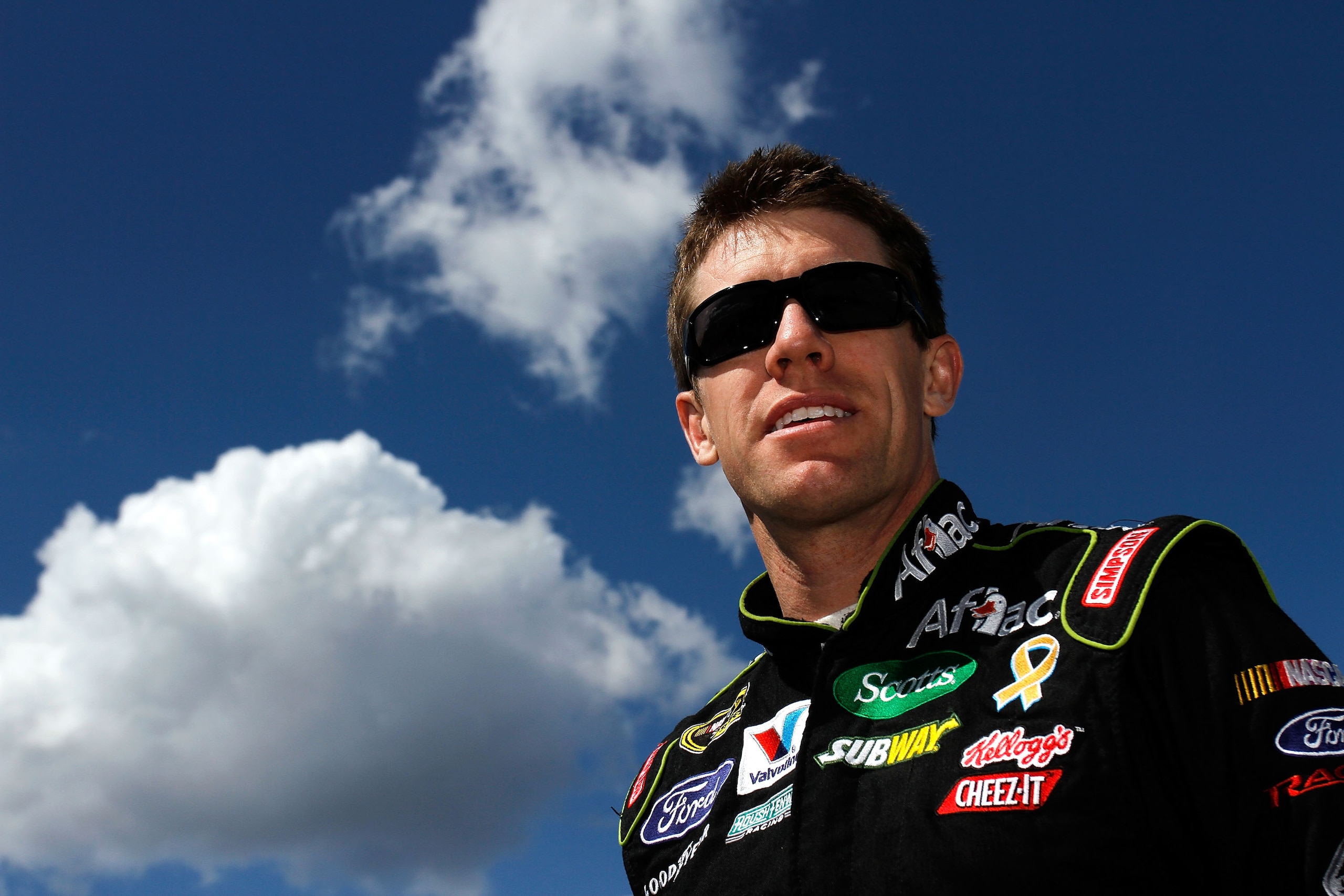 MARTINSVILLE, VA - APRIL 02:  Carl Edwards, driver of the #99 Aflac Ford, stands on the grid during qualifying for the NASCAR Sprint Cup Series Goody's Fast Relief 500 at Martinsville Speedway on April 2, 2011 in Martinsville, Virginia.  (Photo by Jason S