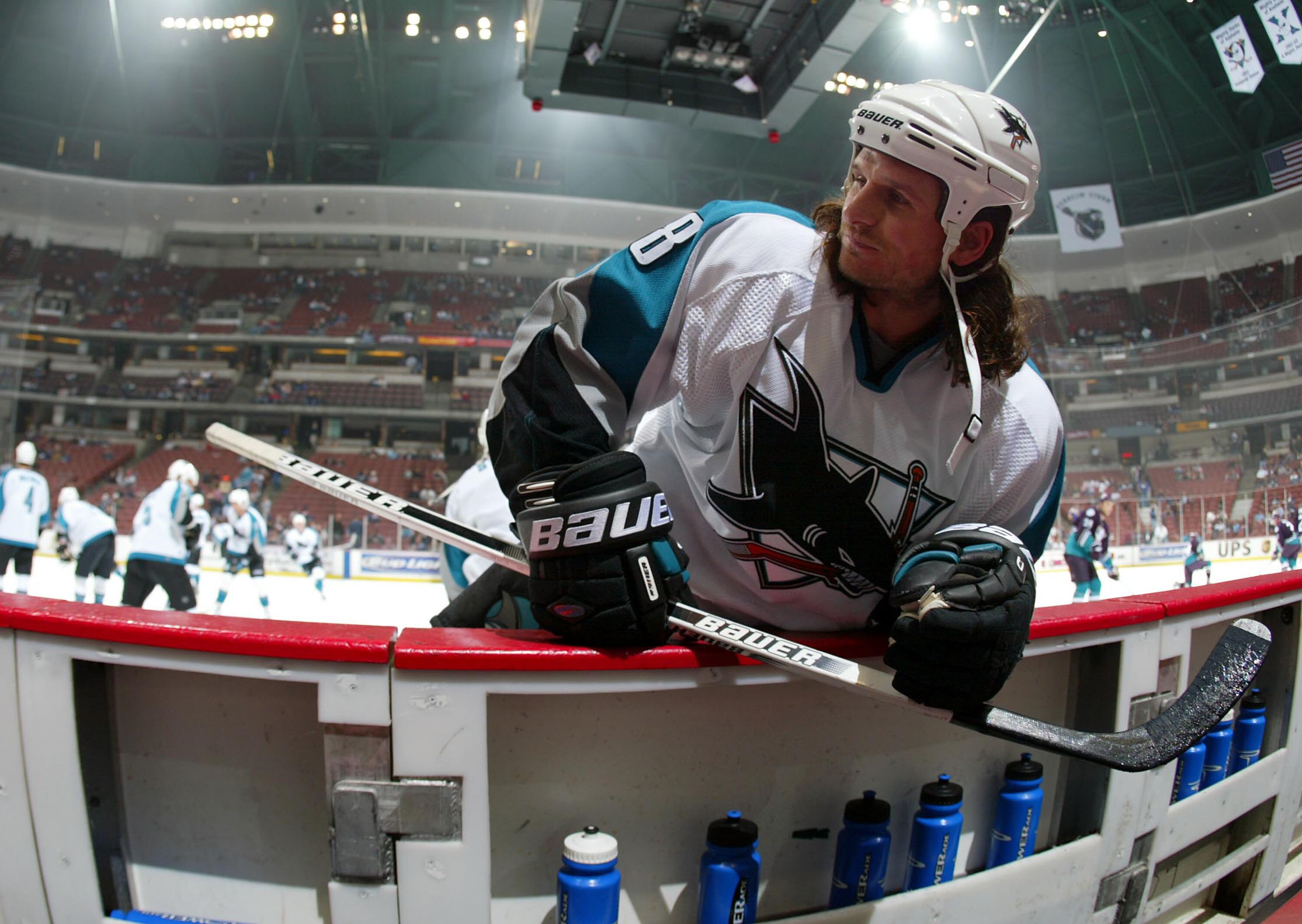 SAN DIEGO - DECEMBER 21:  Mike Ricci #18 of the San Jose Sharks stretches before the start of his team's game against the Anaheim Mighty Ducks on December 21, 2003 at the Arrowhead Pond in Anaheim, California.  (Photo by Donald Miralle/Getty Images)