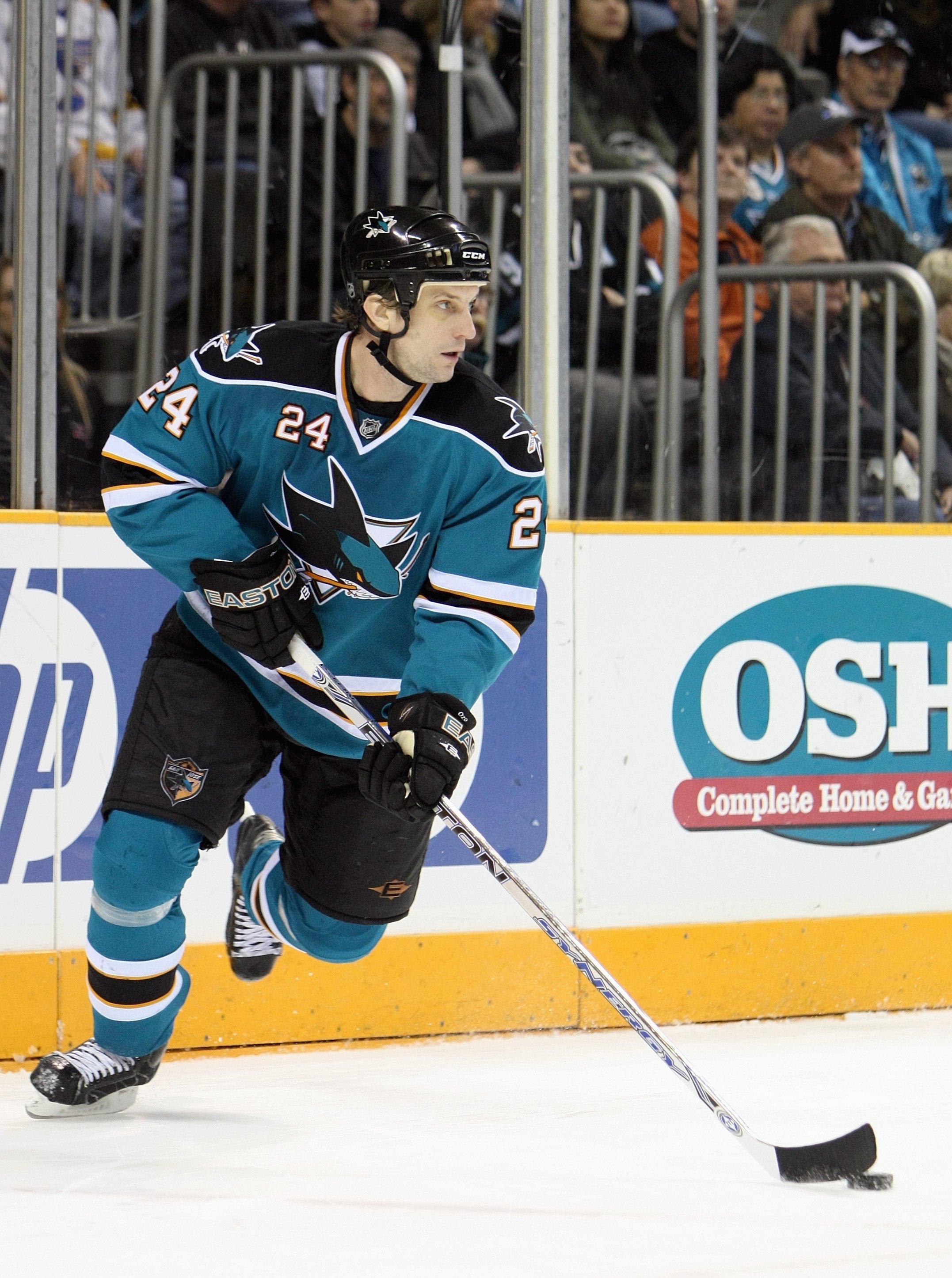 SAN JOSE, CA - JANUARY 24: Sandis Ozolinsh #24 of the San Jose Sharks skates with the puck against the St Louis Blues during an NHL game on January 24, 2008 at the HP Pavillion in San Jose, California. (Photo by Jed Jacobsohn/Getty Images)