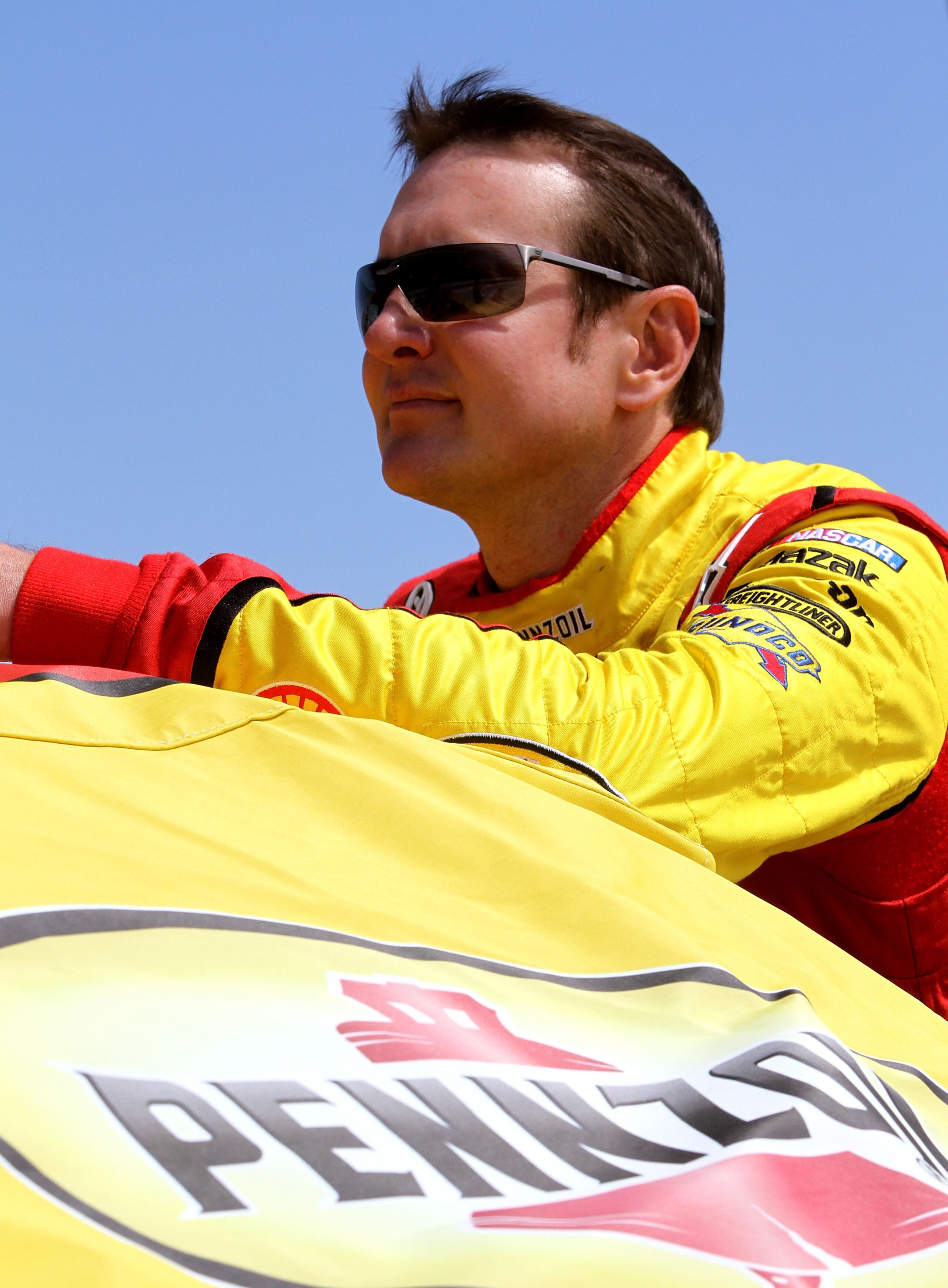 MARTINSVILLE, VA - APRIL 03: Kurt Busch, driver of the #22 Shell/Pennzoil Dodge, stands on the grid prior tor the NASCAR Sprint Cup Series Goody's Fast Relief 500 at Martinsville Speedway on April 3, 2011 in Martinsville, Virginia.  (Photo by Jerry Markla