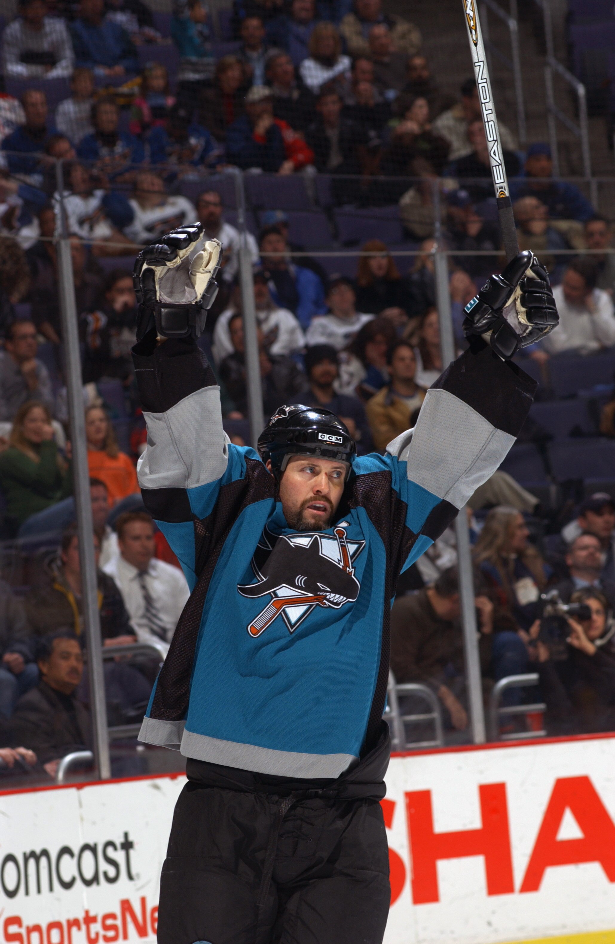 WASHINGTON, D.C. - NOVEMBER 19:  Right wing Owen Nolan #11 of the San Jose Sharks celebrates a goal against the Washington Capitals during the NHL game at the MCI Center on November 19, 2002 in Washington D.C.  The Sharks won 3-2.  (Photo by Doug Pensinge