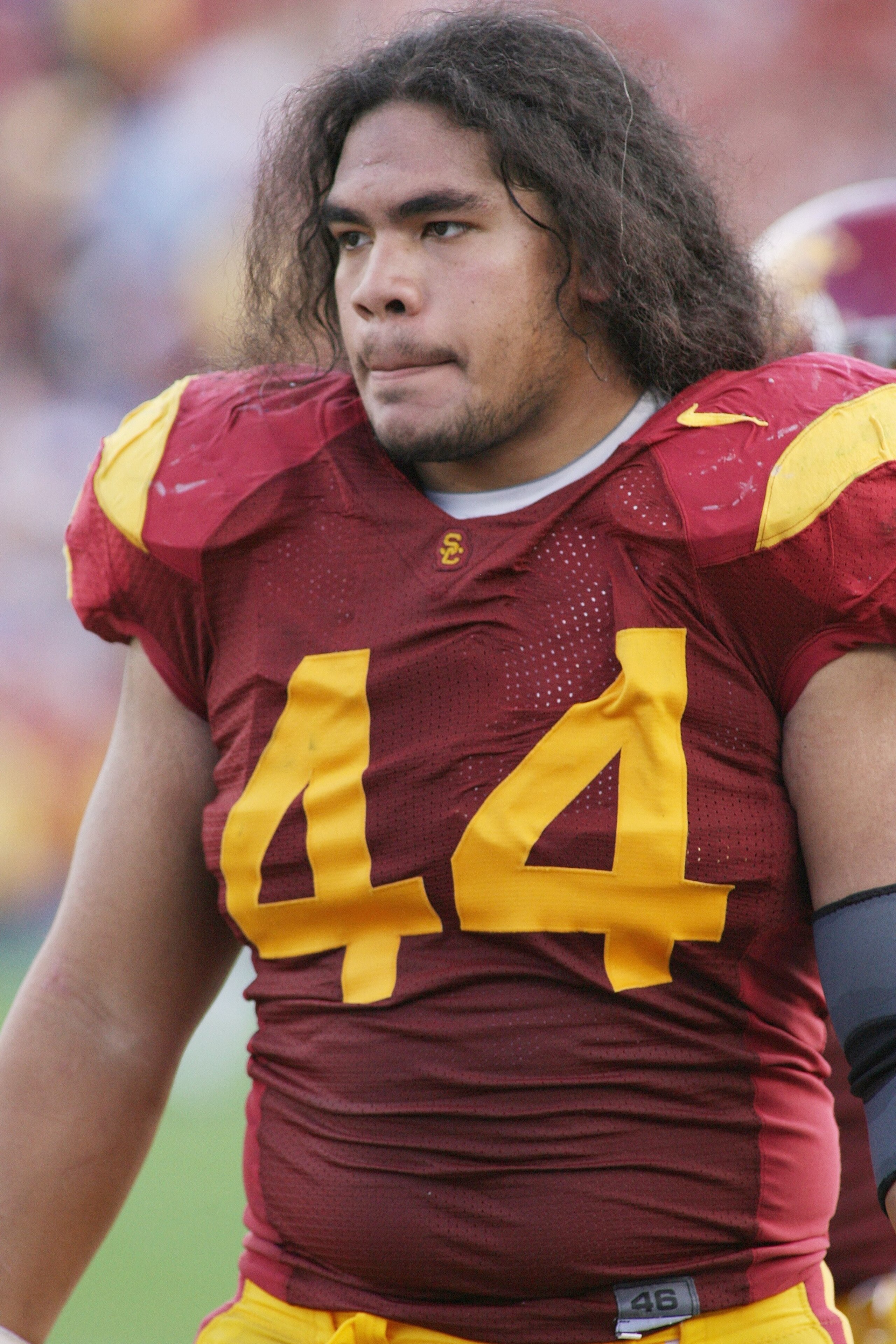PASADENA, CA - DECEMBER 6:  Christian Tupou #44 of the USC Trojans walks on the sideline against the UCLA Bruins on December 6, 2008 at the Rose Bowl in Pasadena, California.  USC won 28-7.  (Photo by Jeff Golden/Getty Images)