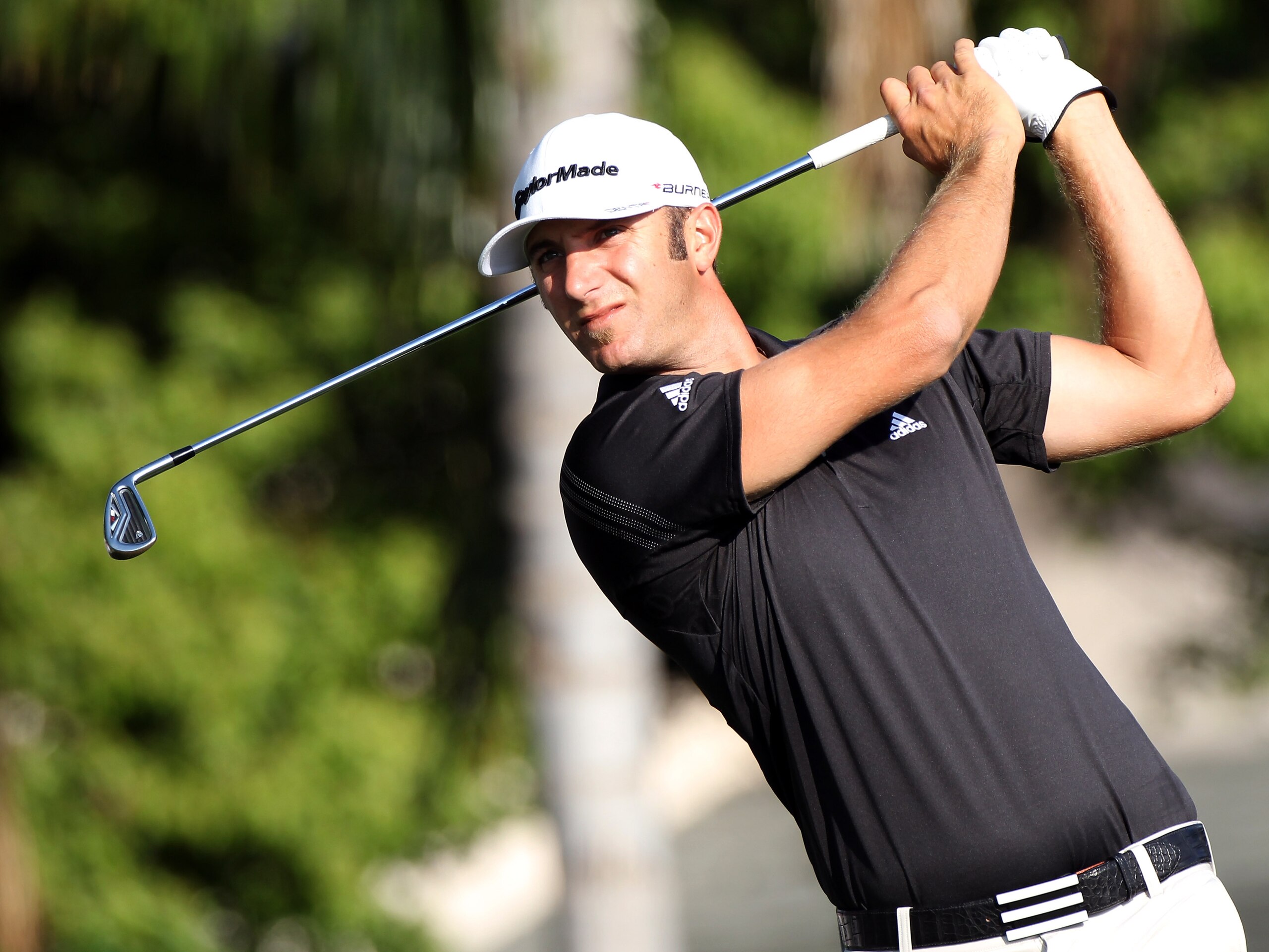 ORLANDO, FL - MARCH 25: Dustin Johnson plays a shot on the 13th hole during the second round of the Bay Hill Invitational presented by MasterCard at the Bay Hill Club and Lodge on March 25, 2011 in Orlando, Florida. (Photo by Sam Greenwood/Getty Images) ORLANDO, FL - MARCH 25: Dustin Johnson plays a shot on the 13th hole during the second round of the Bay Hill Invitational presented by MasterCard at the Bay Hill Club and Lodge on March 25, 2011 in Orlando, Florida. (Photo by Sam Greenwood/Getty Images)