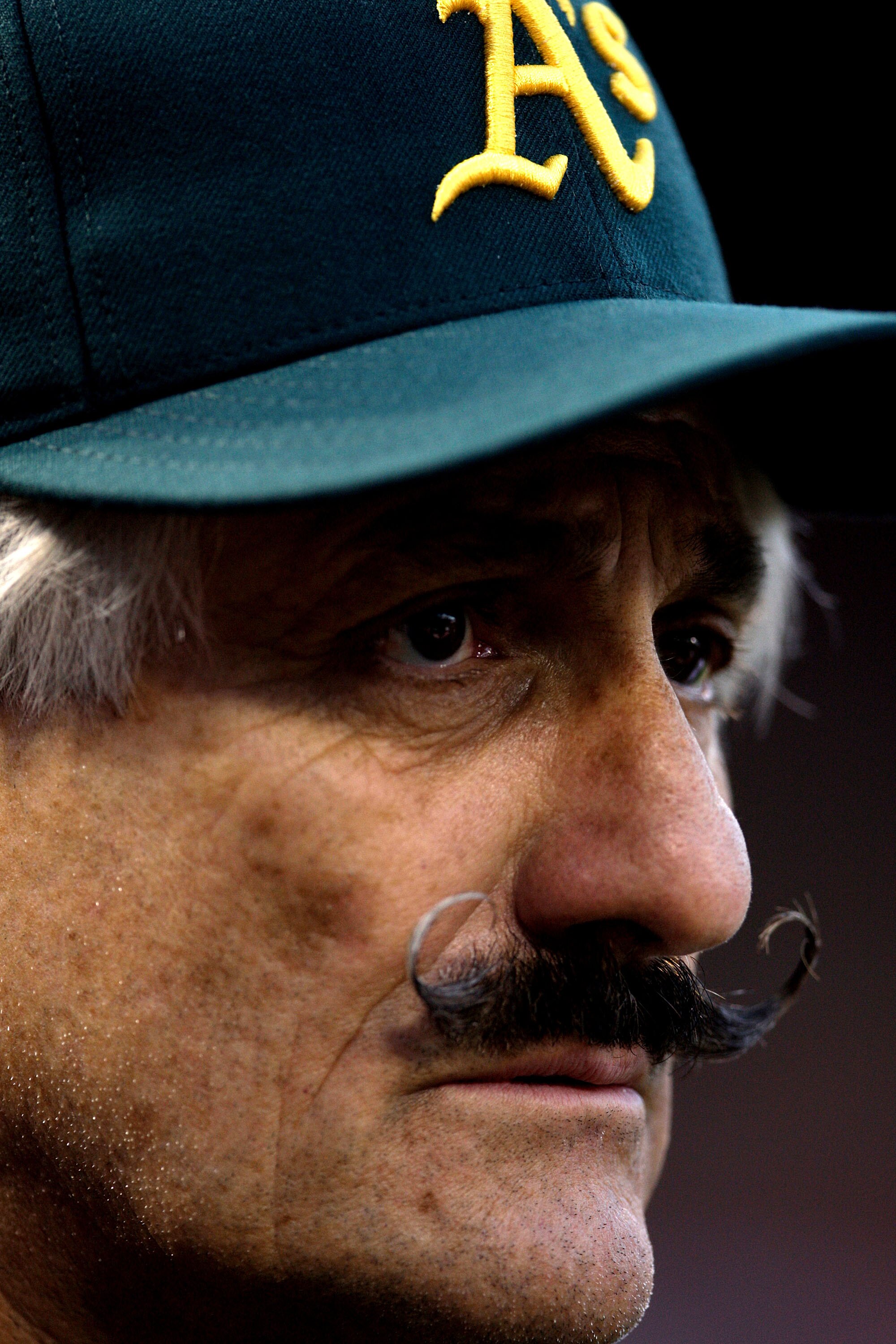 ST LOUIS, MO - JULY 12:  Hall of famer Rollie Fingers looks on during the Taco Bell All-Star Legends & Celebrity Softball Game at Busch Stadium on July 12, 2009 in St. Louis, Missouri.  (Photo by Jamie Squire/Getty Images)