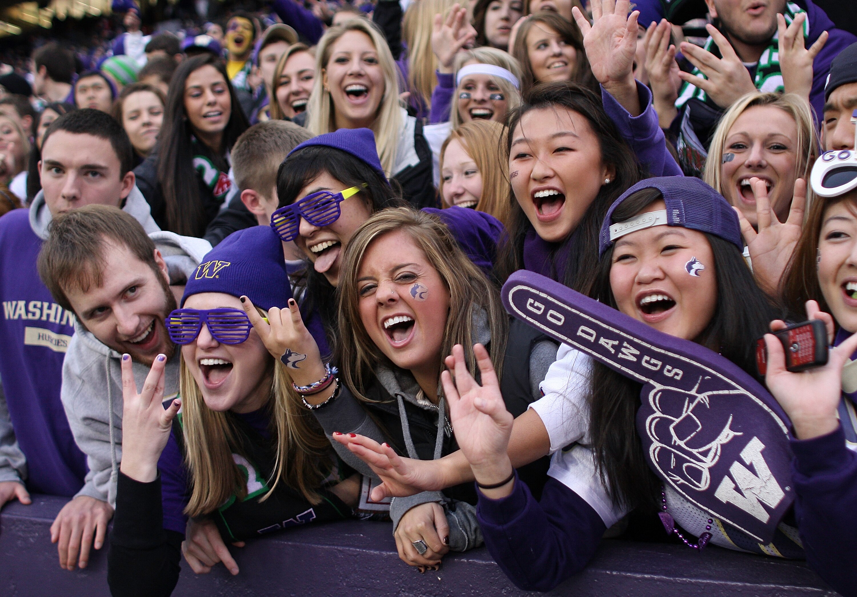 SEATTLE - NOVEMBER 28:  Washington Huskies fans cheer during the game against the Washington State Cougars on November 28, 2009 at Husky Stadium in Seattle, Washington. The Huskies defeated the Cougars 30-0. (Photo by Otto Greule Jr/Getty Images)