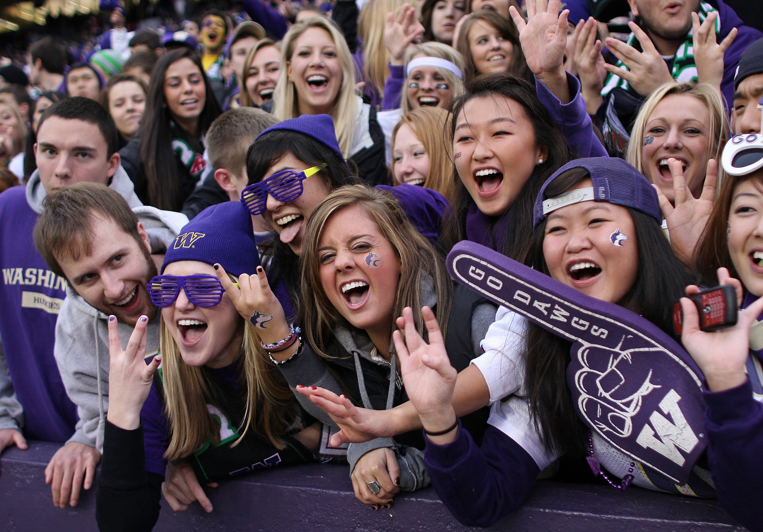 SEATTLE - NOVEMBER 28: Washington Huskies fans cheer during the game against the Washington State Cougars on November 28, 2009 at Husky Stadium in Seattle, Washington. The Huskies defeated the Cougars 30-0. (Photo by Otto Greule Jr/Getty Images) SEATTLE - NOVEMBER 28: Washington Huskies fans cheer during the game against the Washington State Cougars on November 28, 2009 at Husky Stadium in Seattle, Washington. The Huskies defeated the Cougars 30-0. (Photo by Otto Greule Jr/Getty Images)