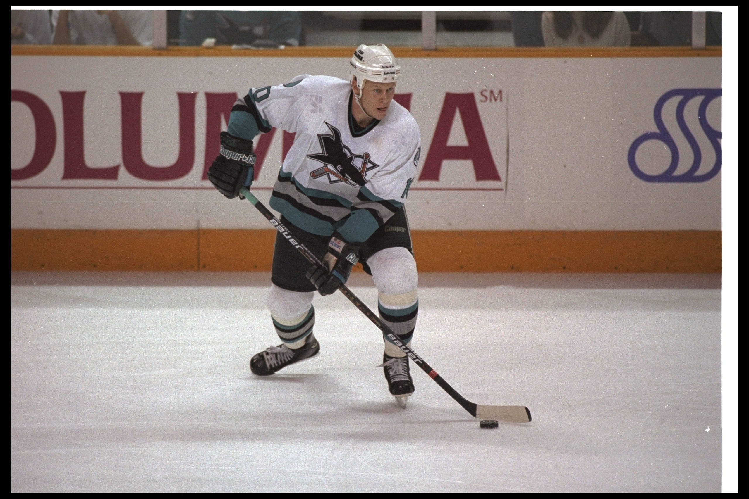 Defenseman Marcus Ragnarsson of the San Jose Sharks moves the puck during a game against the Colorado Avalanche at the San Jose Arena in San Jose, California. The Sharks won the game, 2-1.