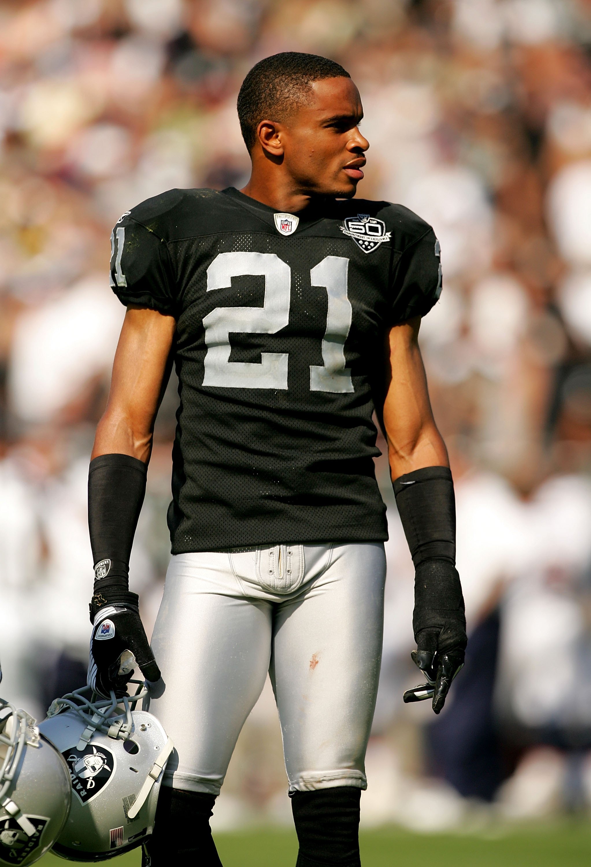 OAKLAND, CA - SEPTEMBER 27:  Nnamdi Asomugha #21 takes off his helmet during a break in play in their game against the Denver Broncos at the Oakland-Alameda County Coliseum on September 27, 2009 in Oakland, California.  (Photo by Ezra Shaw/Getty Images)