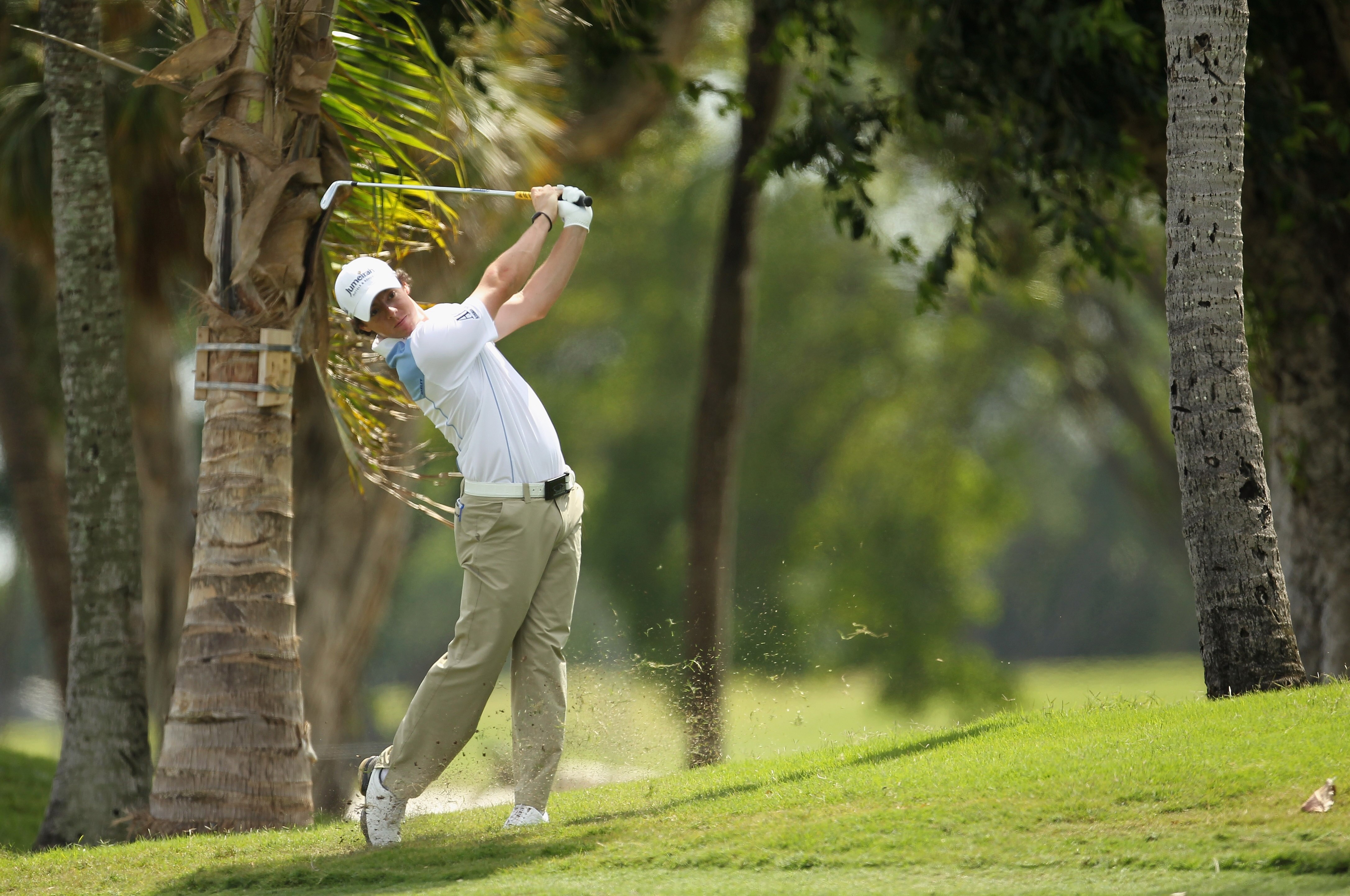DORAL, FL - MARCH 12:  Rory McIlroy of Northern Ireland hits a shot from the rough on the first hole during the third round of the 2011 WGC- Cadillac Championship at the TPC Blue Monster at the Doral Golf Resort and Spa on March 12, 2011 in Doral, Florida