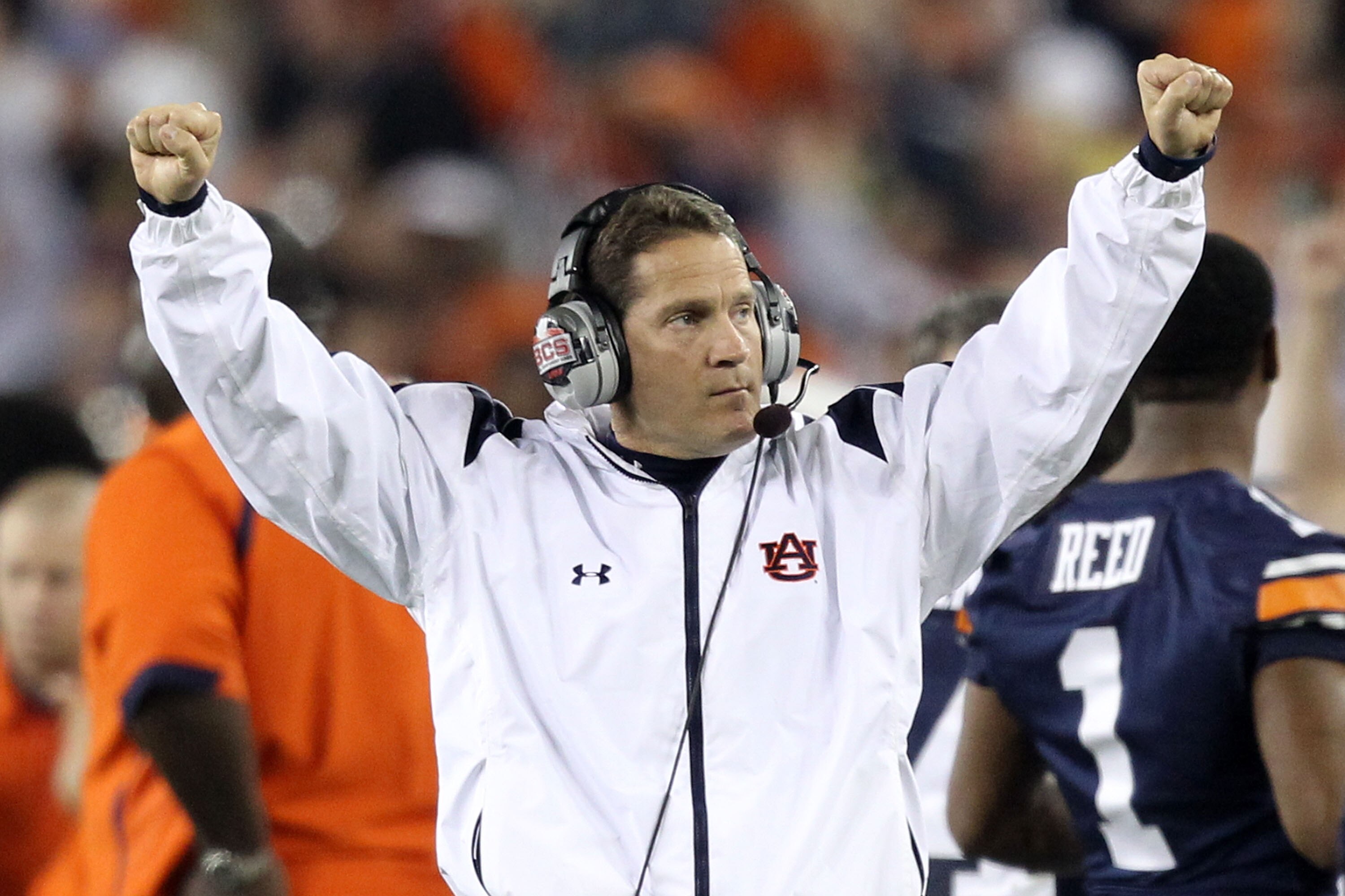 GLENDALE, AZ - JANUARY 10:  Head coach Gene Chizik of the Auburn Tigers reacts on the sideline against the Oregon Ducks during the Tostitos BCS National Championship Game at University of Phoenix Stadium on January 10, 2011 in Glendale, Arizona.  (Photo b
